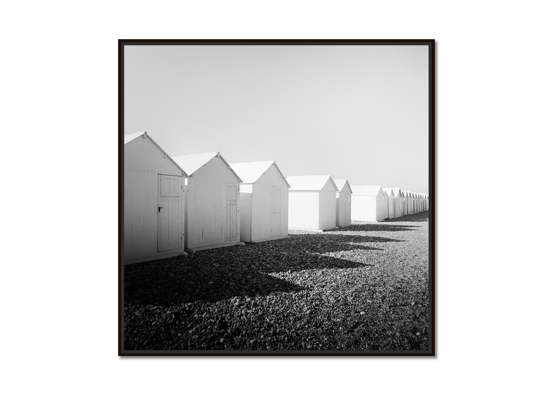 Row of Beach Huts, rocky beach, black and white, fine art, landscape photography - Photograph by Gerald Berghammer