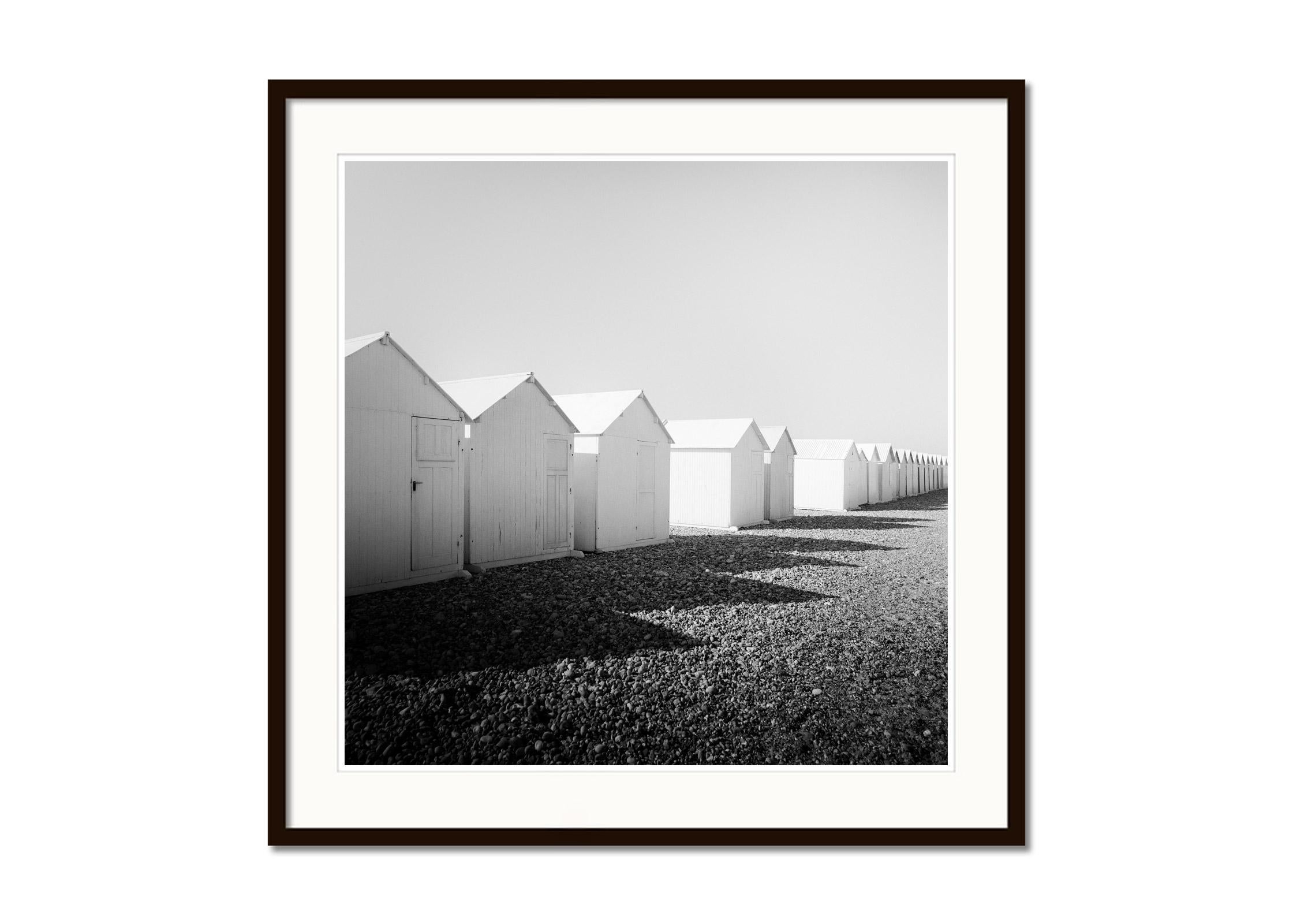 Row of Beach Huts, rocky beach, black and white, fine art, landscape photography - Gray Landscape Photograph by Gerald Berghammer