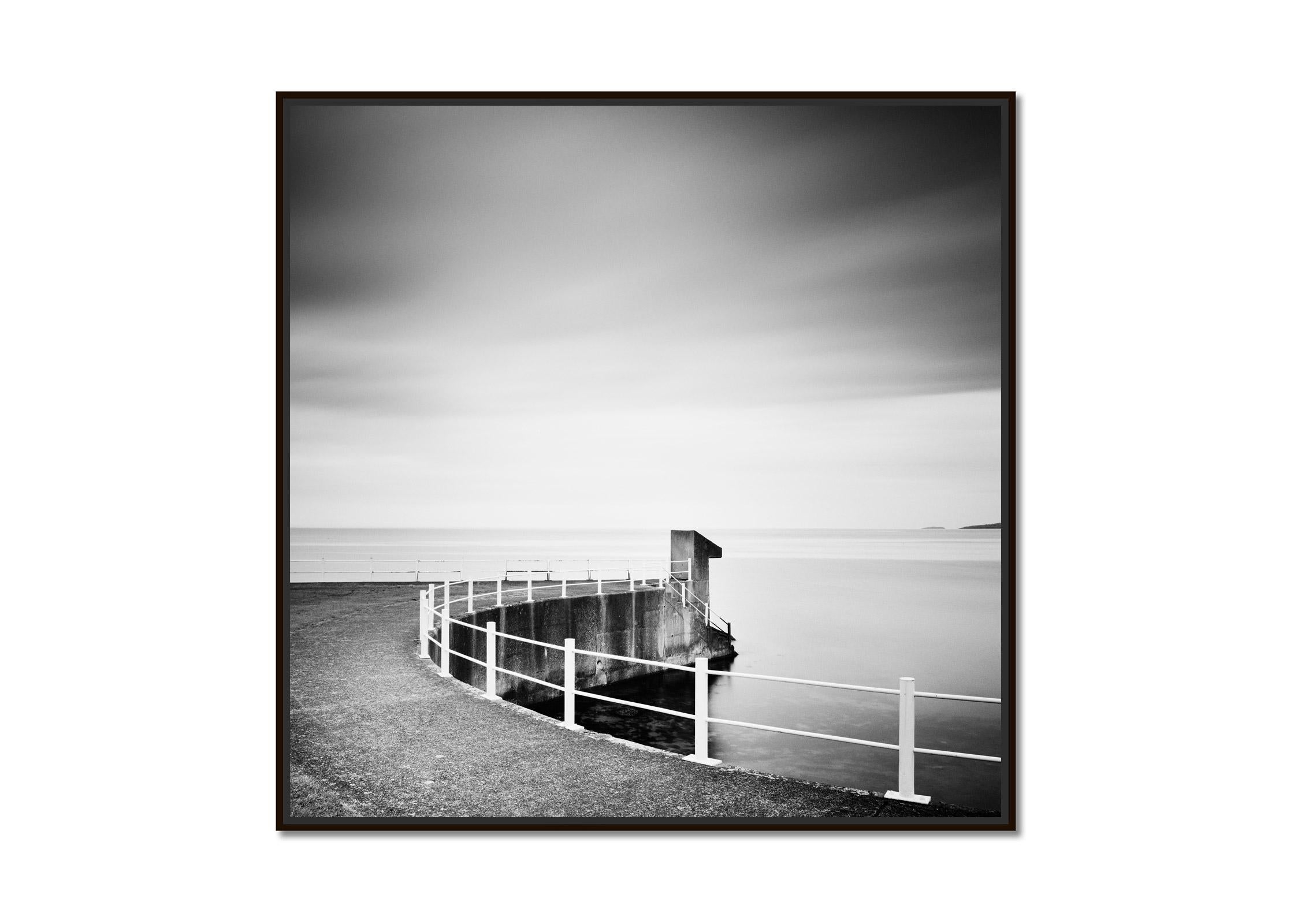 Seaside, Promenade, Ireland, black and white waterscape landscape photography - Photograph by Gerald Berghammer