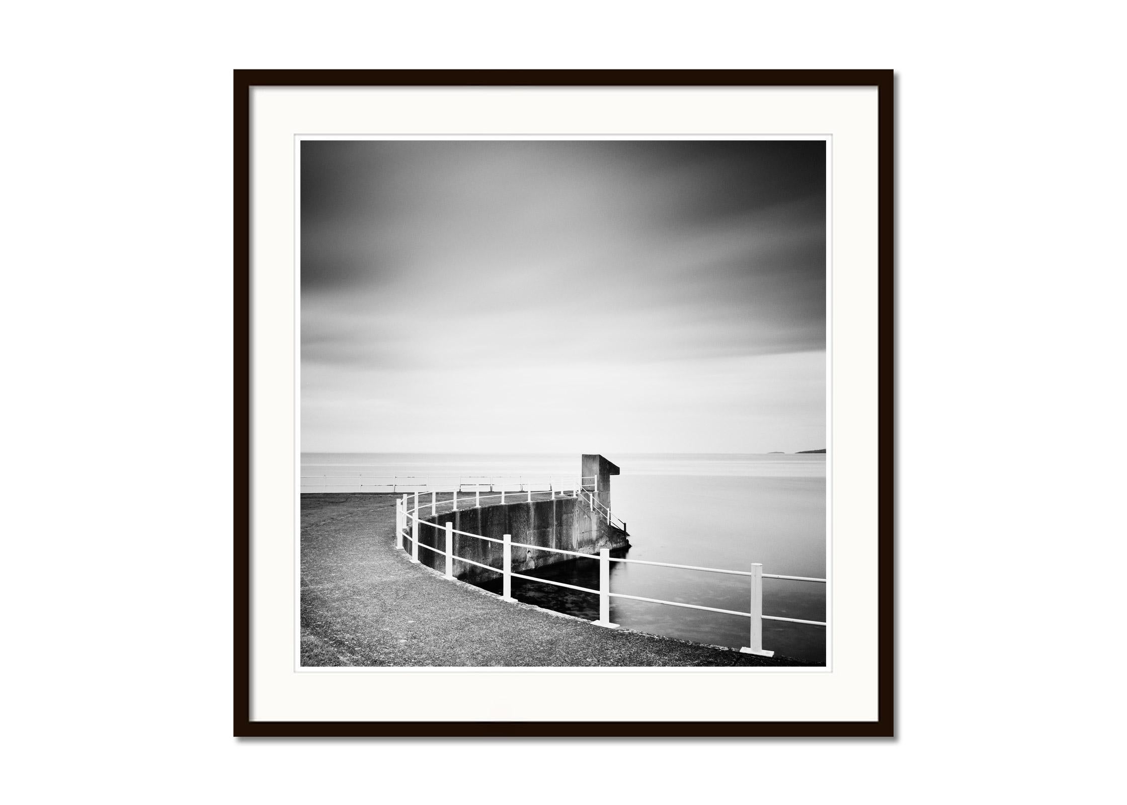 Seaside, Promenade, Ireland, black and white waterscape landscape photography - Gray Black and White Photograph by Gerald Berghammer