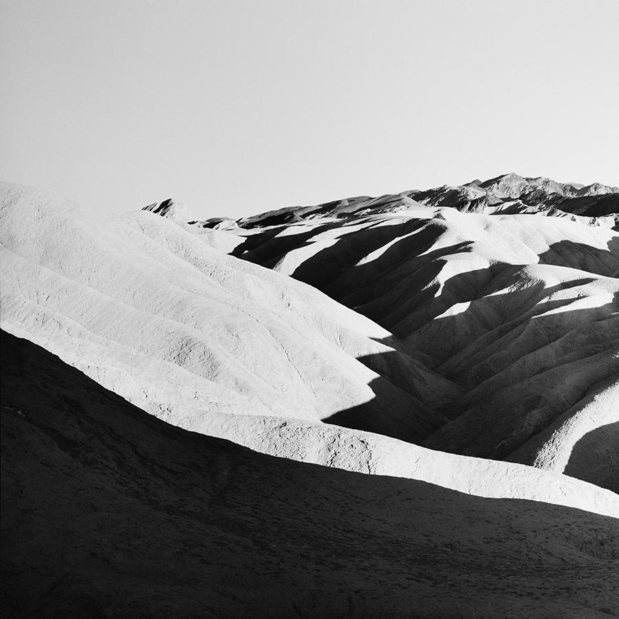 Black and White Fine Art city and landscape photography. Zabriskie Point in Death Valley, California, USA, limited edition of 9. Signed, titled, dated and numbered by artist. Certificate of authenticity included. Printed with 4cm white border.
