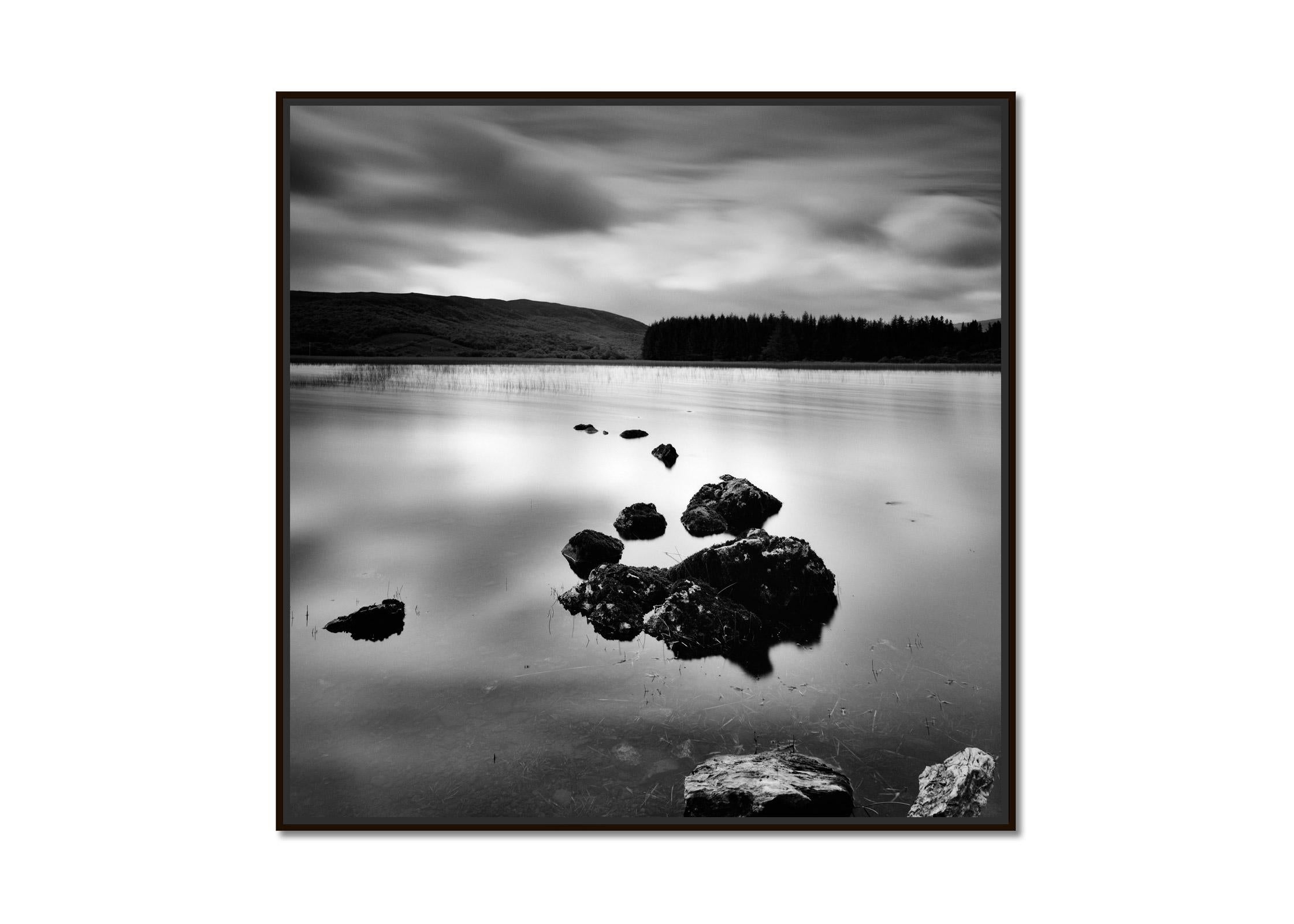 Shore and Stone lake view sunset in the highlands Scotland black white landscape - Photograph by Gerald Berghammer