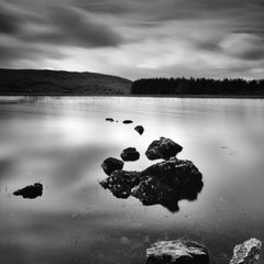 Shore and Stone lake view sunset in the highlands Scotland black white landscape