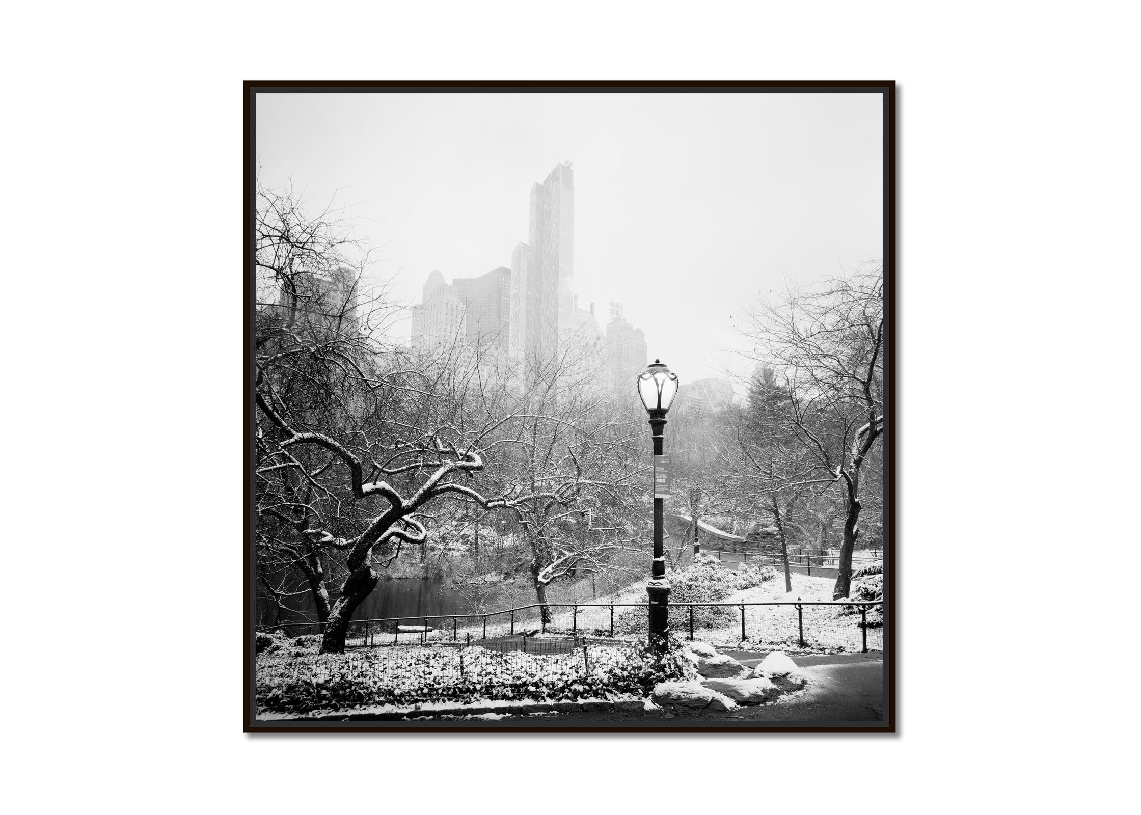 Snow covered Central Park, New York City, black and white cityscape photography - Photograph by Gerald Berghammer