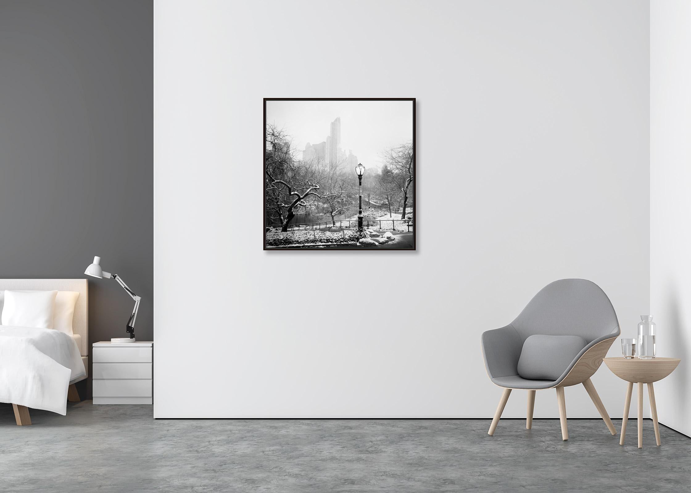 Snow covered Central Park New York City black and white cityscape photography - Contemporary Photograph by Gerald Berghammer