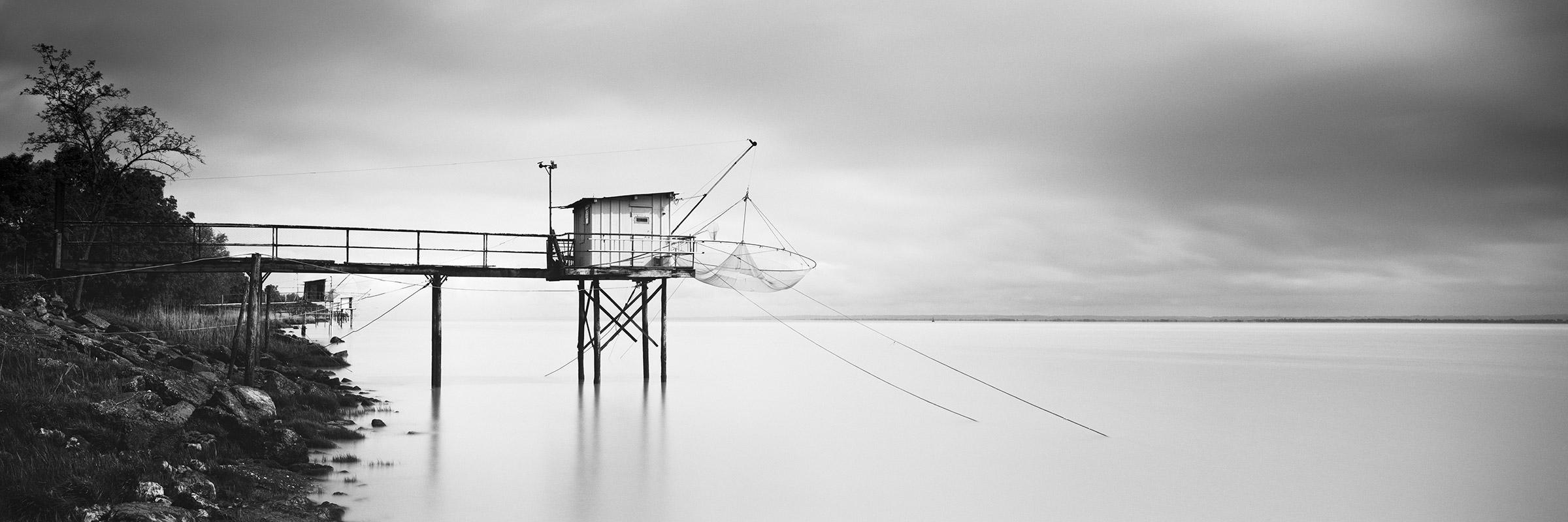Gerald Berghammer Black and White Photograph - Stilt House Panorama, Fishing, Storm, black white fineart landscape photography