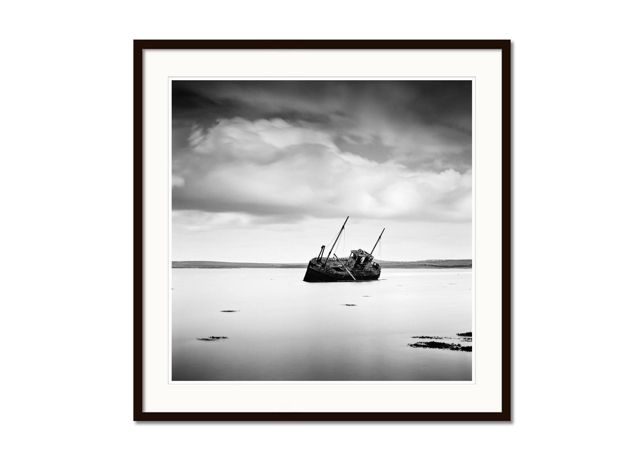 Stranded fishing Boat, beach, Ireland, black and white photography, landscape - Minimalist Photograph by Gerald Berghammer