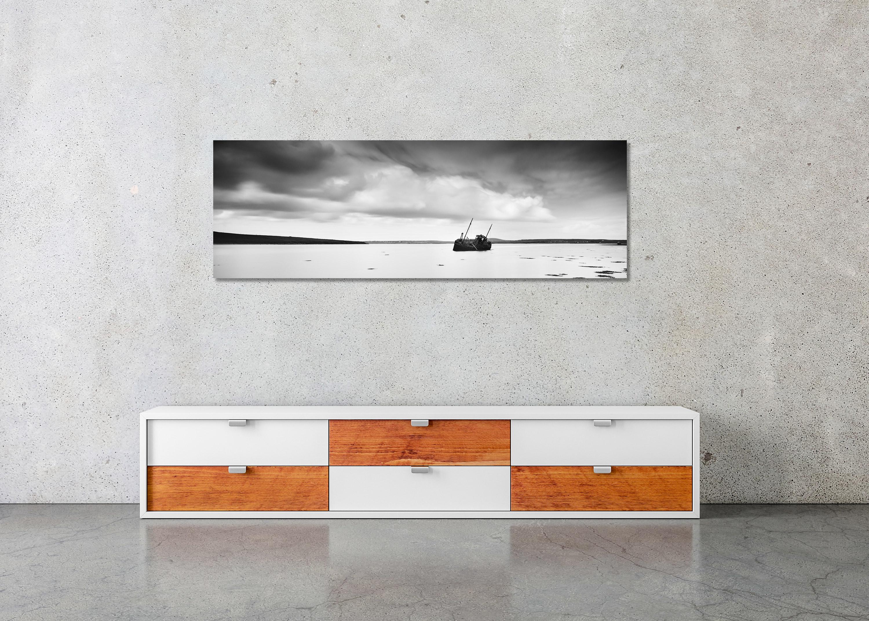 Black and White Fine Art long exposure panorama waterscape photography. Stranded fishing boat in a beautiful bay in, Ireland. Archival pigment ink print, edition of 9. Signed, titled, dated and numbered by artist. Certificate of authenticity