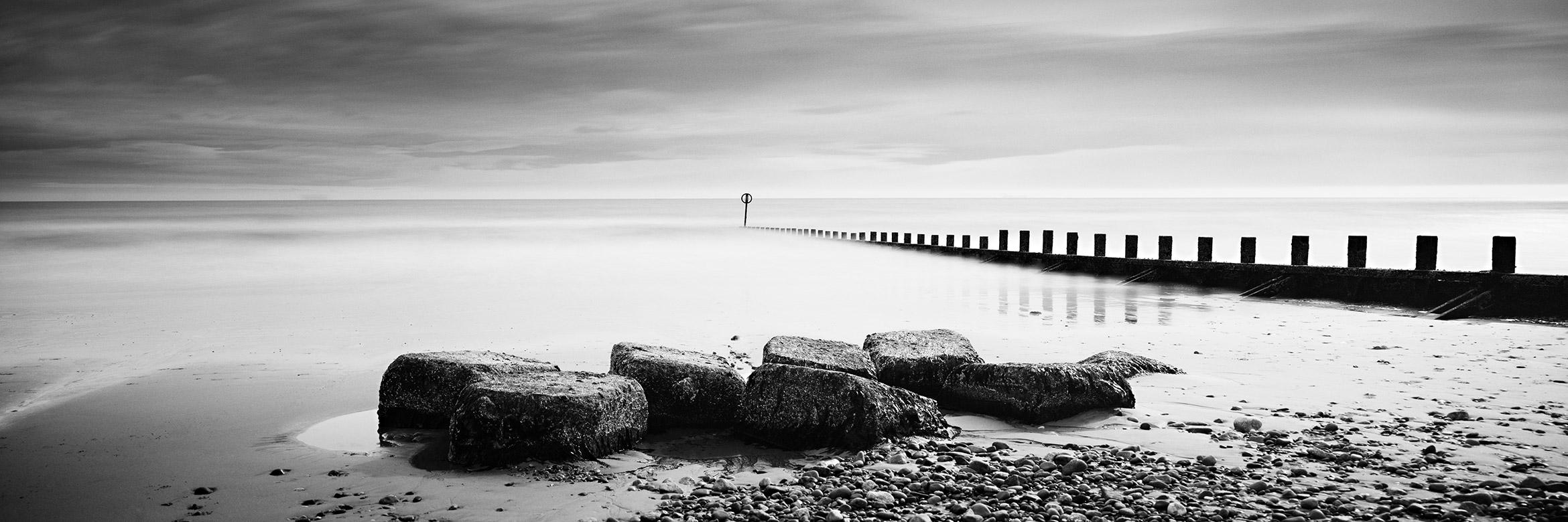 Gerald Berghammer Black and White Photograph - Wavebreaker, Panorama, Rocks, Scotland, Black & White long exposure photography