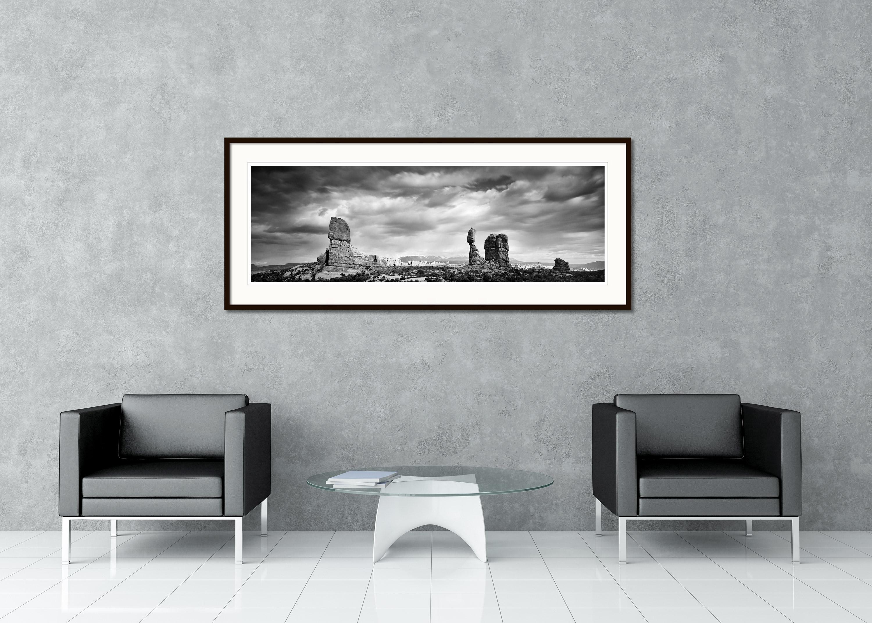 Black and White Fine Art landscape photography. Rock formations in the beautiful arches national park with big clouds, Utah, USA. Archival pigment ink print, edition of 9. Signed, titled, dated and numbered by artist. Certificate of authenticity