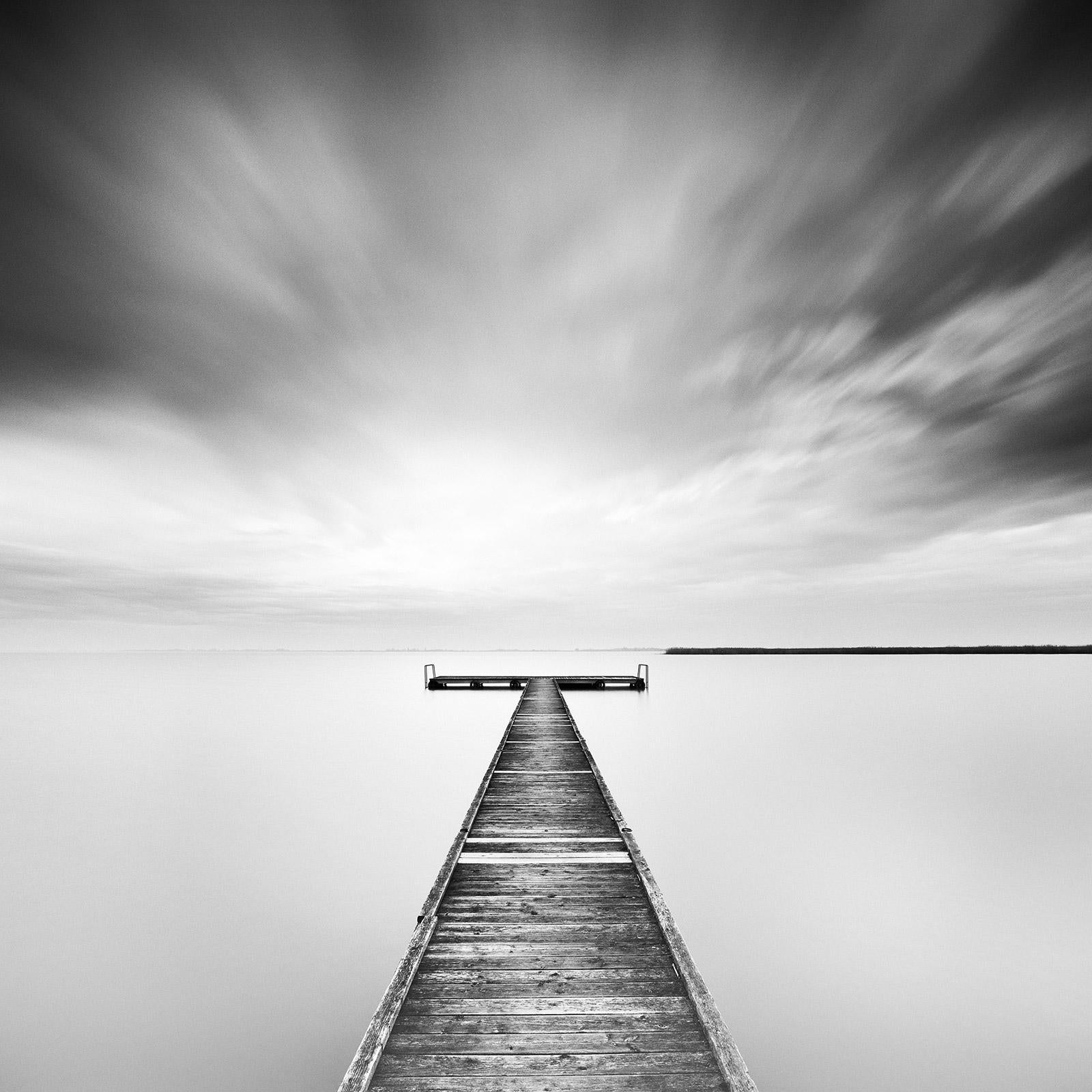 Gerald Berghammer Black and White Photograph - Winter Storm, lake, minimalist wood pier, black white art waterscape photography