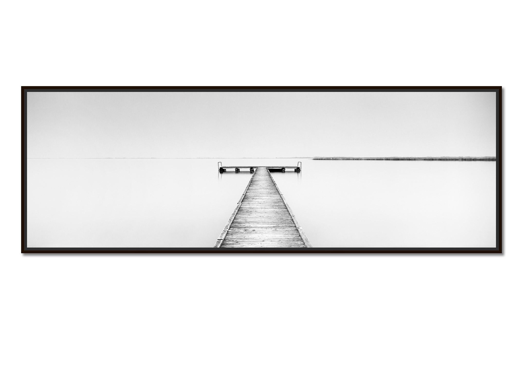 Wood Pier Panorama, minimalist black and white waterscape photography art print - Photograph by Gerald Berghammer