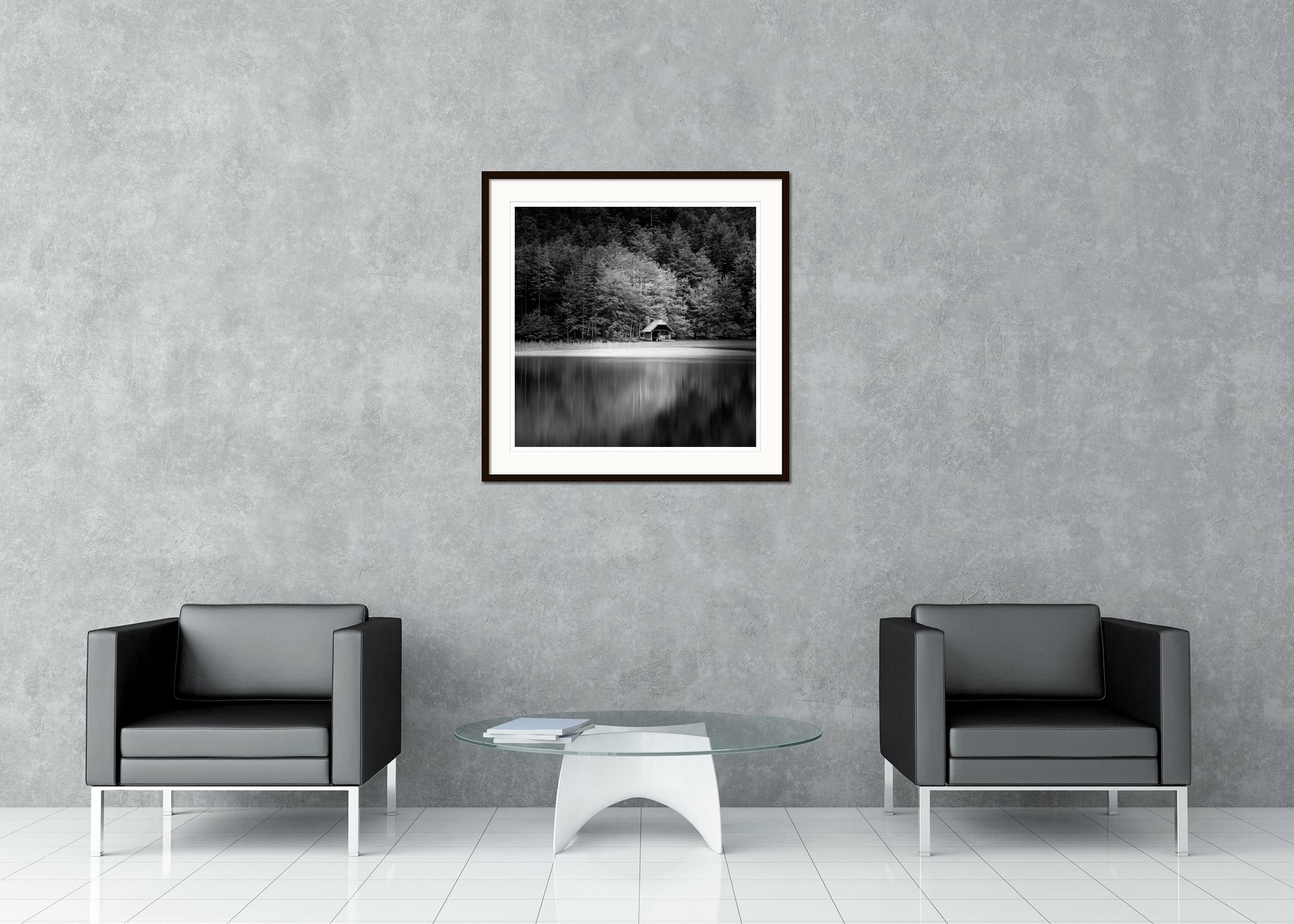 Black and white fine art long exposure waterscape - landscape photography. Wooden boat house, the mountains, the lake and the forest, Austria. Archival pigment ink print as part of a limited edition of 9. All Gerald Berghammer prints are made to