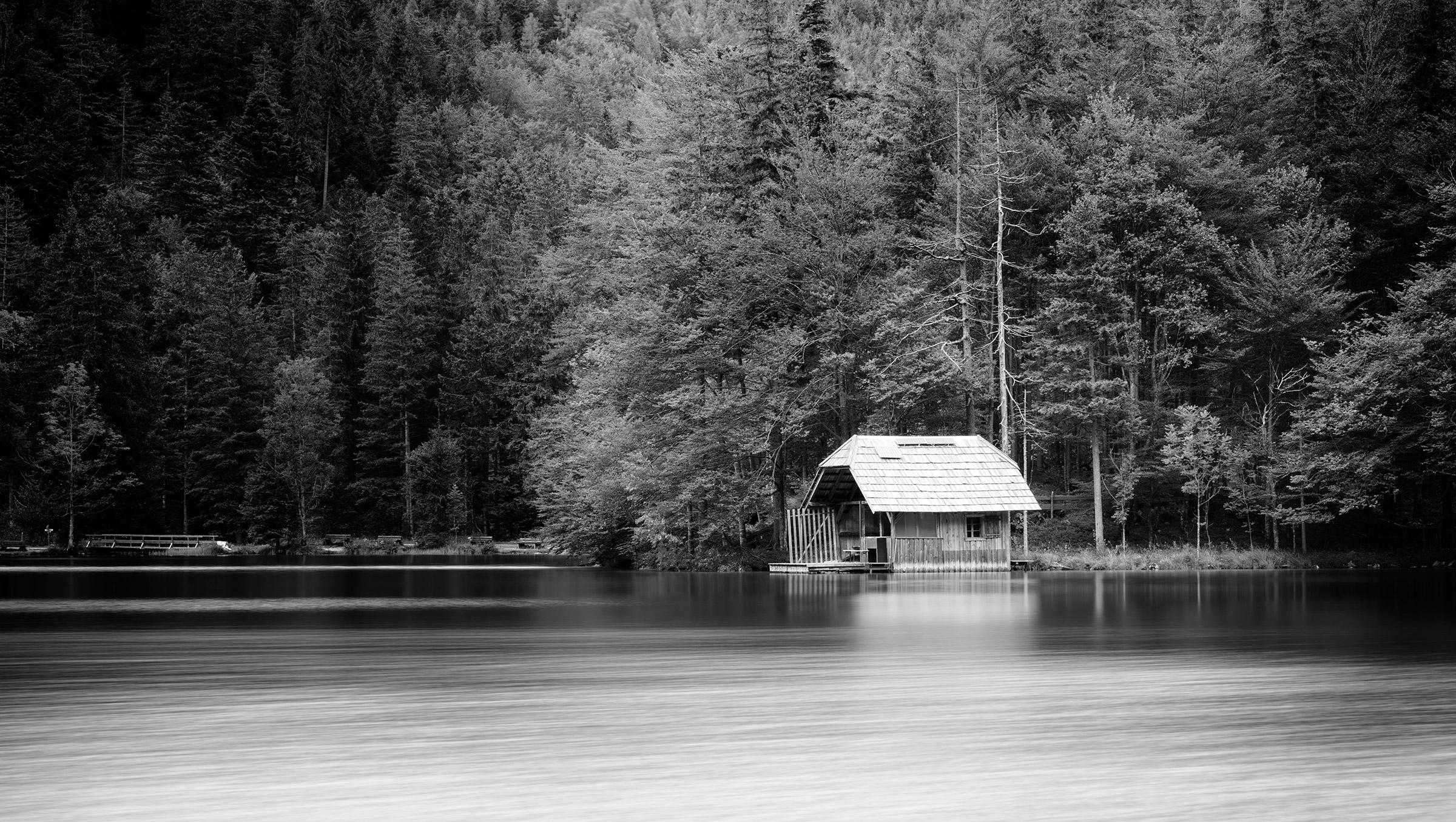 Gerald Berghammer Landscape Photograph - Wooden Boat House Panorama, Austria, black and white art waterscape photography 