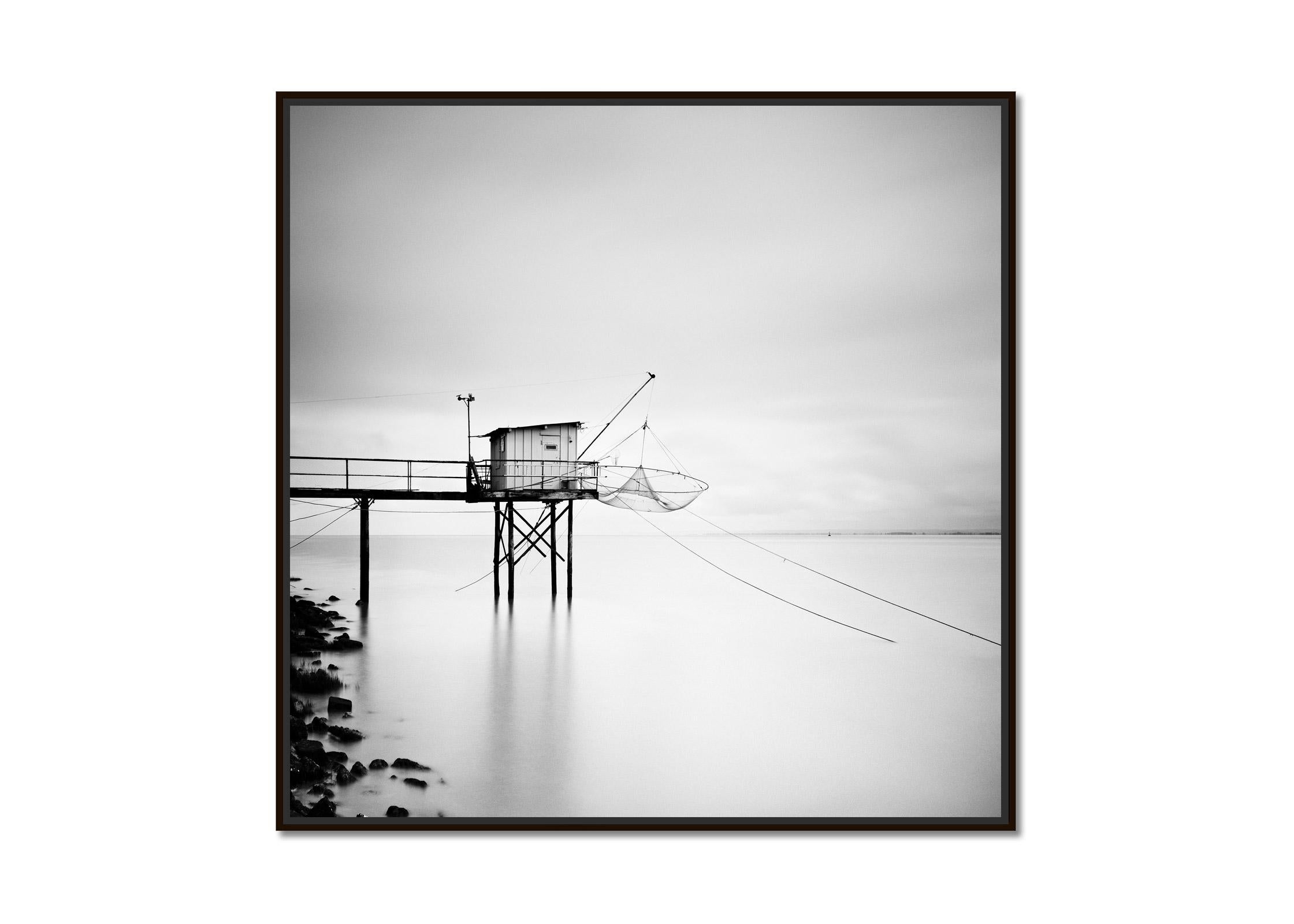 Wooden fishing Hut on Stilts, France, black and white art waterscape photography - Photograph by Gerald Berghammer