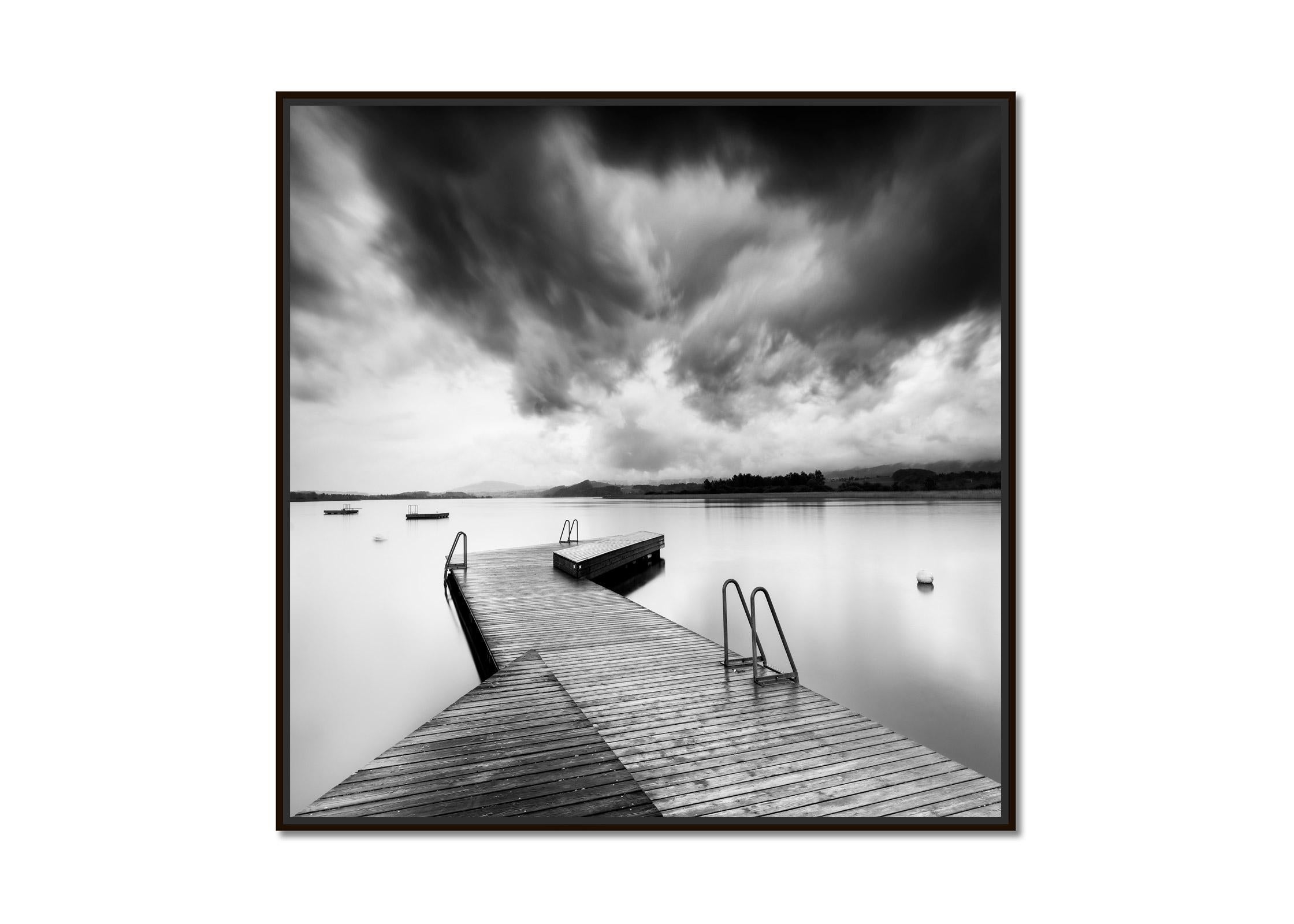 Wooden Pier during Storm, long exposure, black and white waterscape photography  - Photograph by Gerald Berghammer