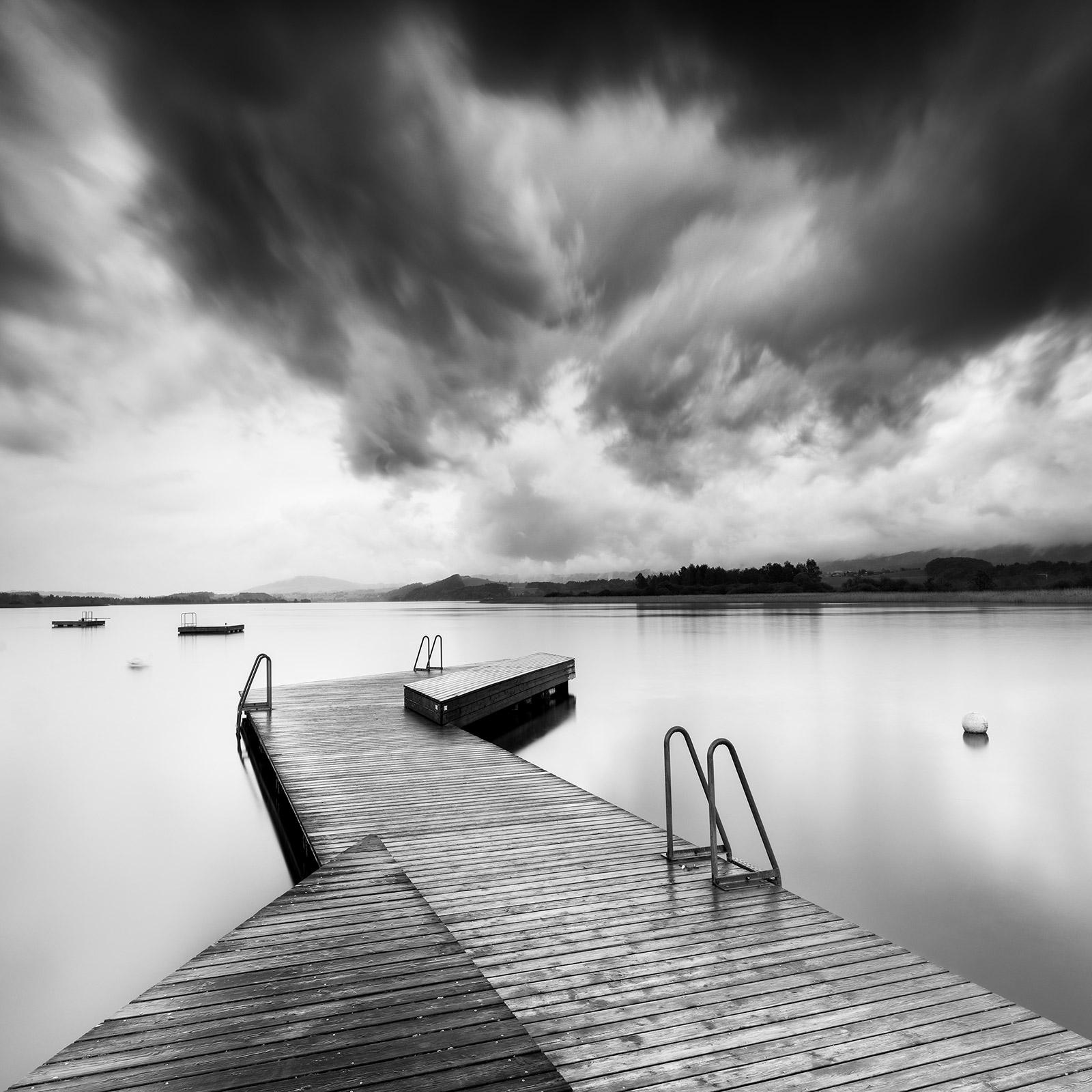 Gerald Berghammer Black and White Photograph - Wooden Pier during Storm, long exposure, black and white waterscape photography 