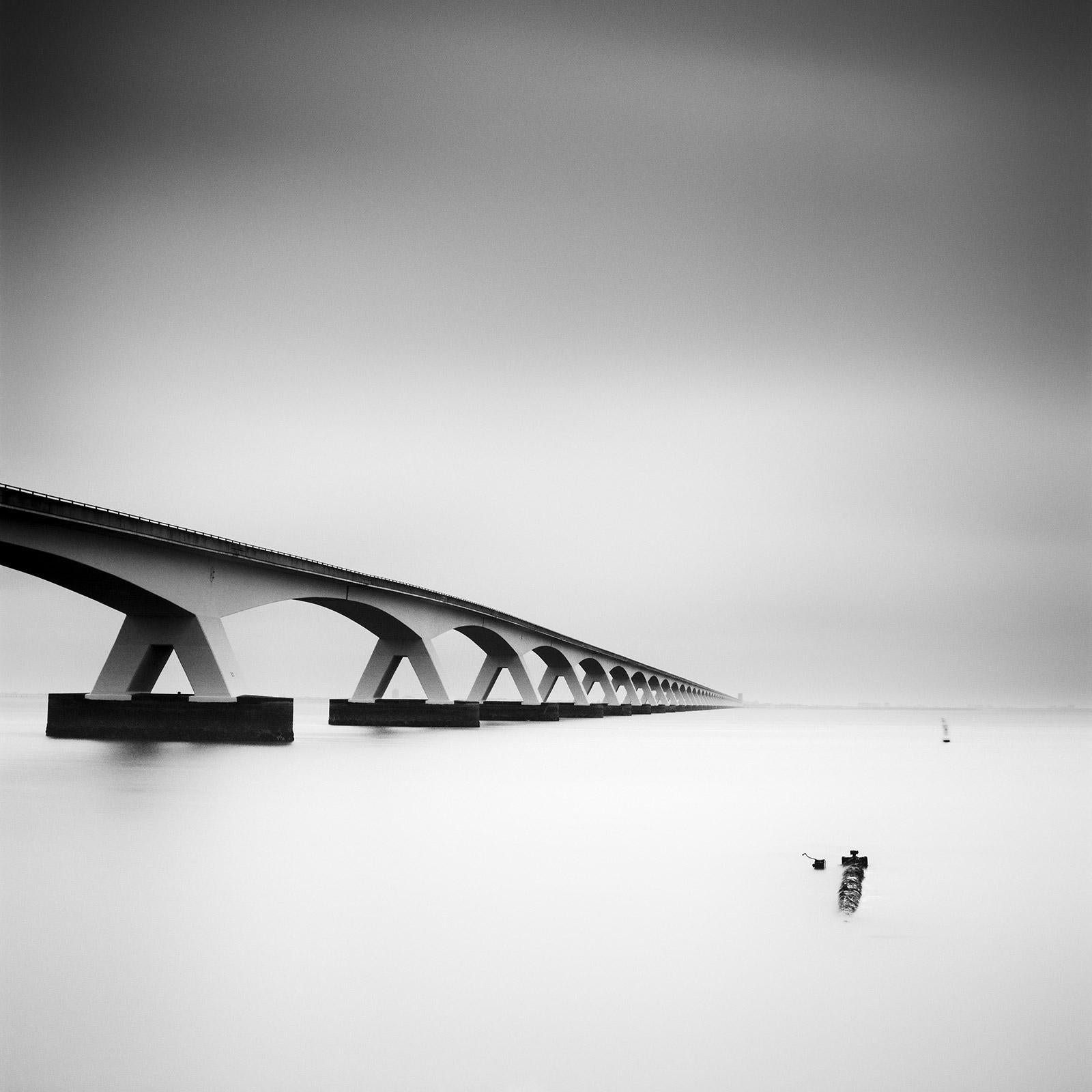 Gerald Berghammer Landscape Photograph - Zeeland Bridge, Netherlands, long exposure, black and white photography, prints