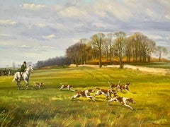 English fox hunting scene with fox hounds, men up on horse back in a landscape
