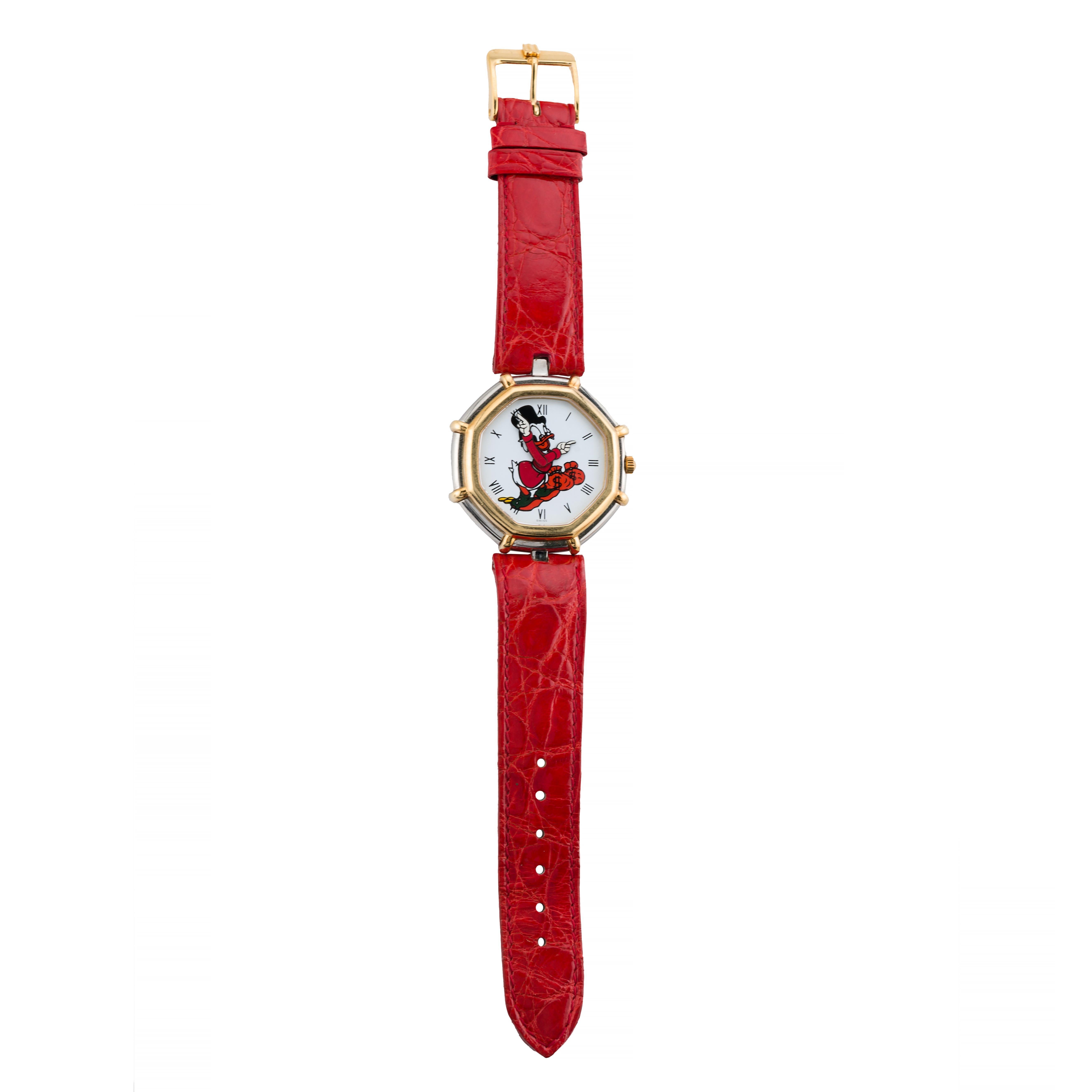 Aston Estate Jewelry Presents:

A Gérald Genta for Disney wrist watch crafted in stainless steel and gold.

The octagonal case measures 35mm in width, featuring a whimsical dial adorned with Roman numerals. The dial showcases a playful animated