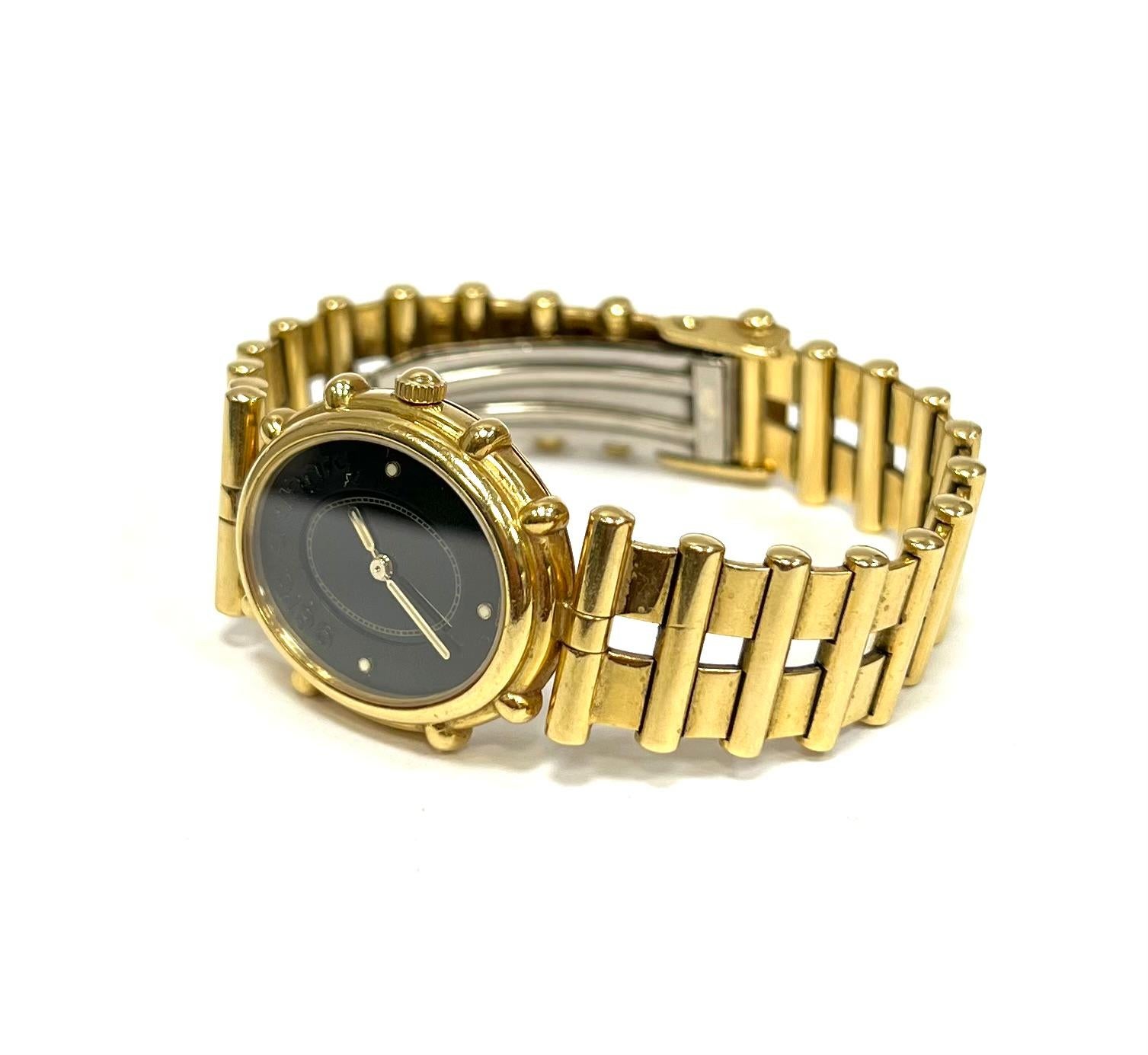  Gérald Genta 18K Yellow Gold Ladies Watch On Gold Bracelet.
Black Dial, Swiss Quartz Movement.
Excellent Condition.