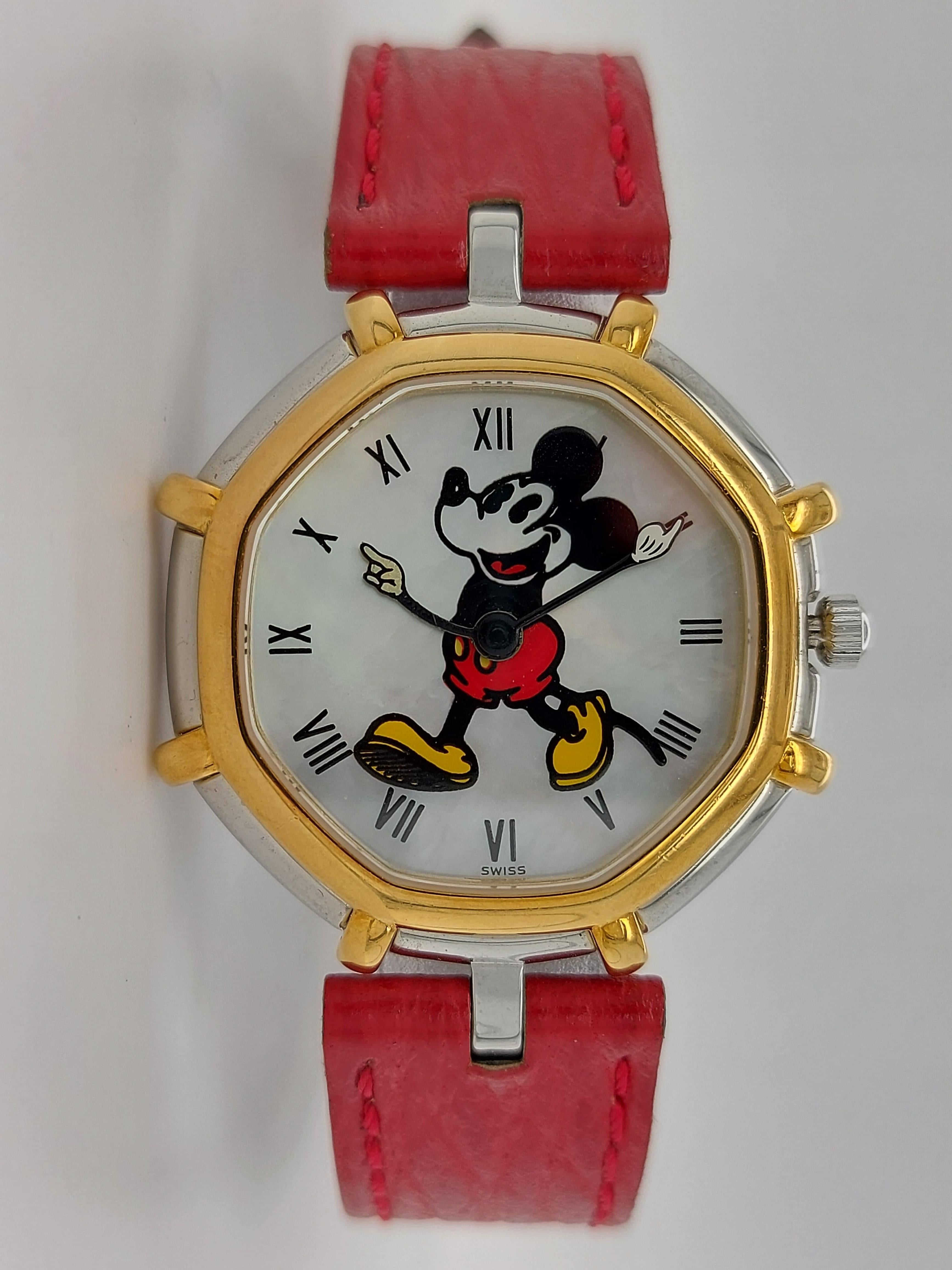 Gerald Genta Mickey Mouse Quartz Watch Red Leather Strap 

Very rare and exclusive collectors watch !

Movement: Quartz

Functions: Hours, Minutes

Case: Stainless steel and 18kt yellow gold bezel, diameter 34 mm, rear lid marked: Gerald Genta