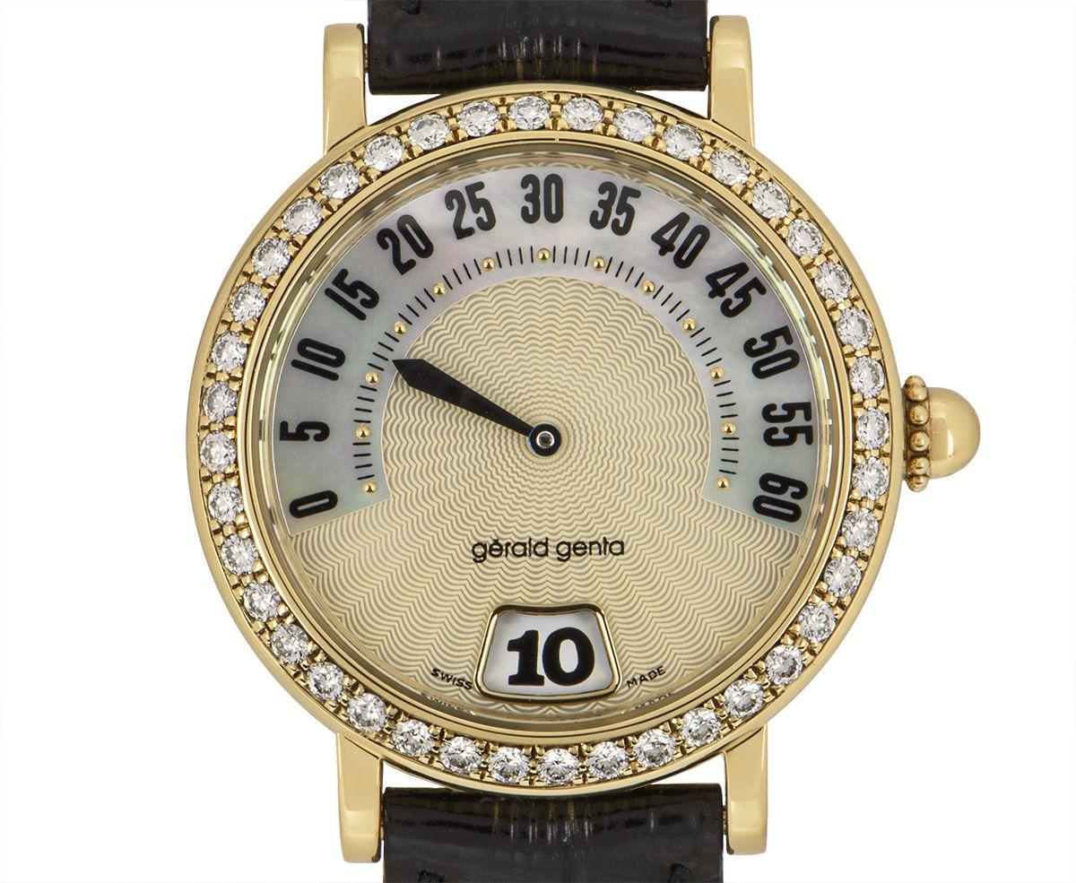 A 33.5 mm yellow gold Retro Classic by Gerald Genta, featuring a guilloche mother of pearl dial with a retrograde minute display and hour display at 6 o'clock. The diamond-set bezel features 40 round brilliant cut diamonds. An original black leather
