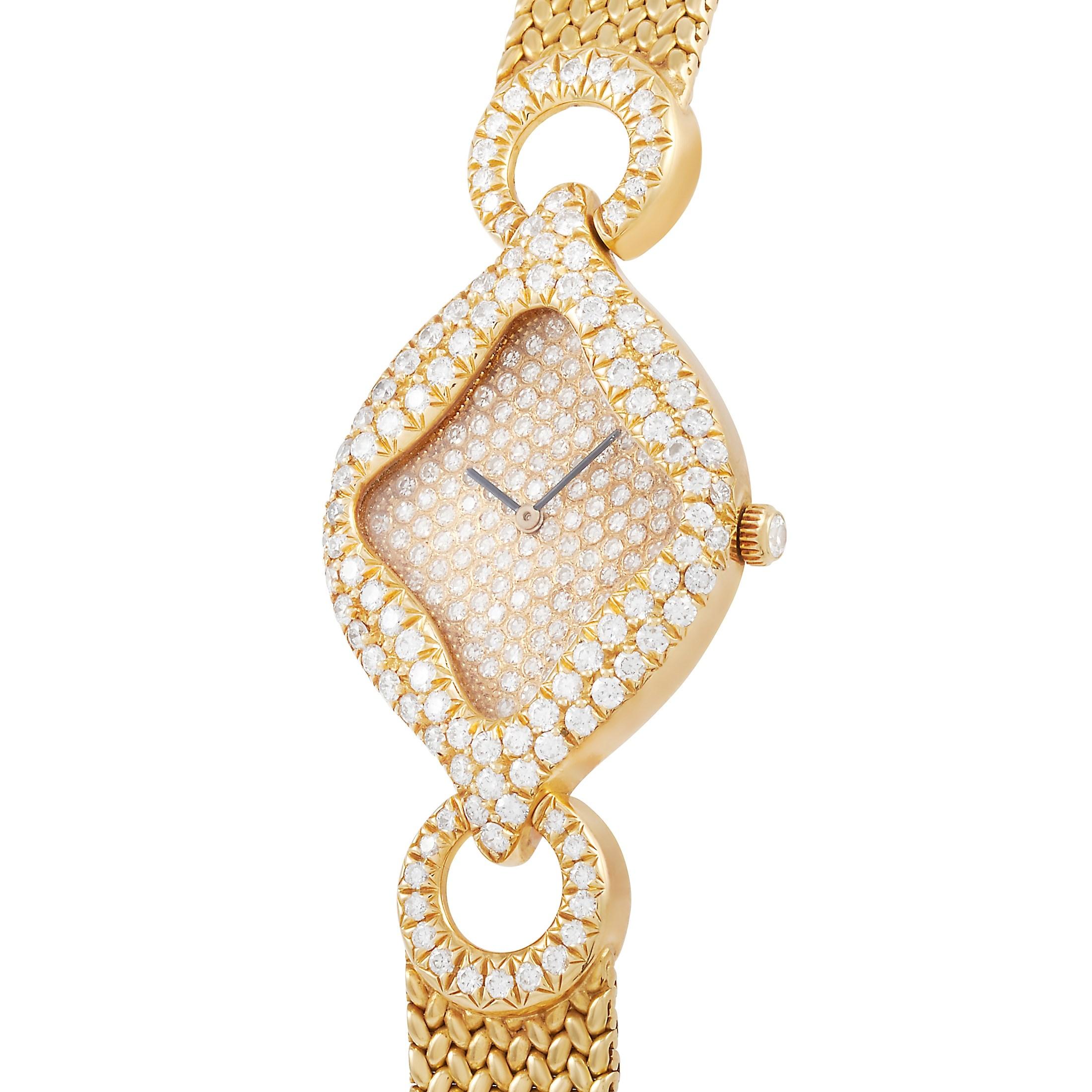 This is a very special watch that was made for the Sultan of Oman by Gerald Genta and Royama. The unique piece is presented in 18K yellow gold, and features a two row diamond bezel in a distinctive diamond shape case. The case is presented on a