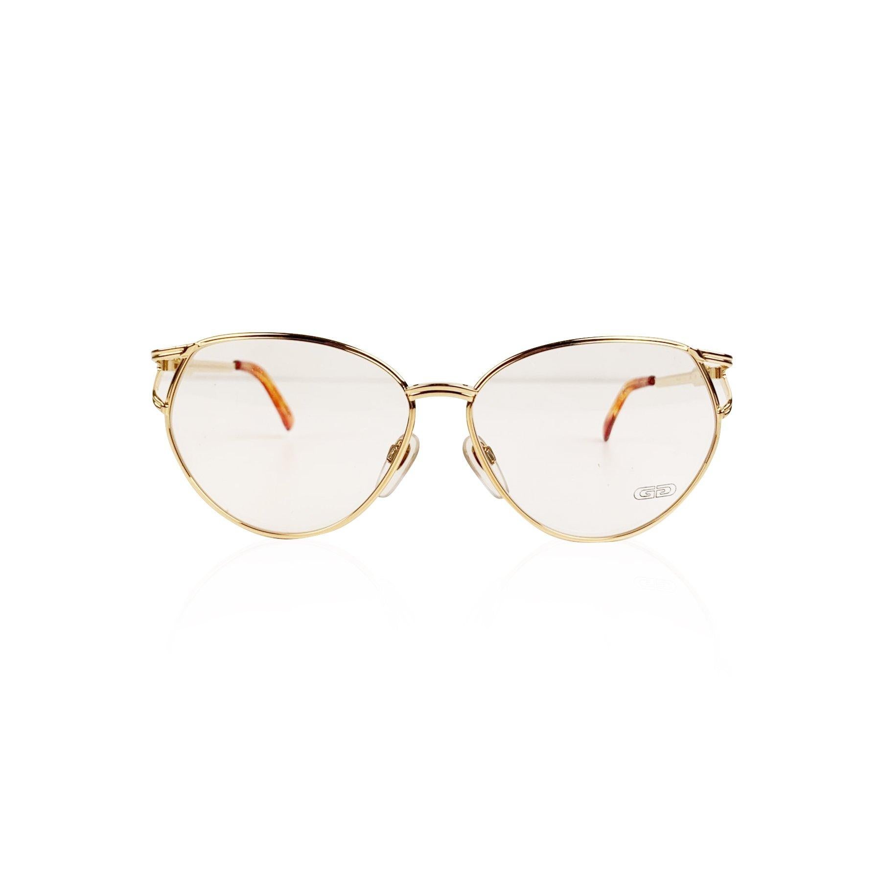Gold plated eyeglasses by Gerald Genta by Orama, from the early 1990s. Model: New Classic 05 - AU - 130 - 9301932 - CE93. Beautiful gold frame. Clear demo lenses. Hand Made in Italy. Details MATERIAL: Gold Plated COLOR: Gold MODEL: New Classic 05