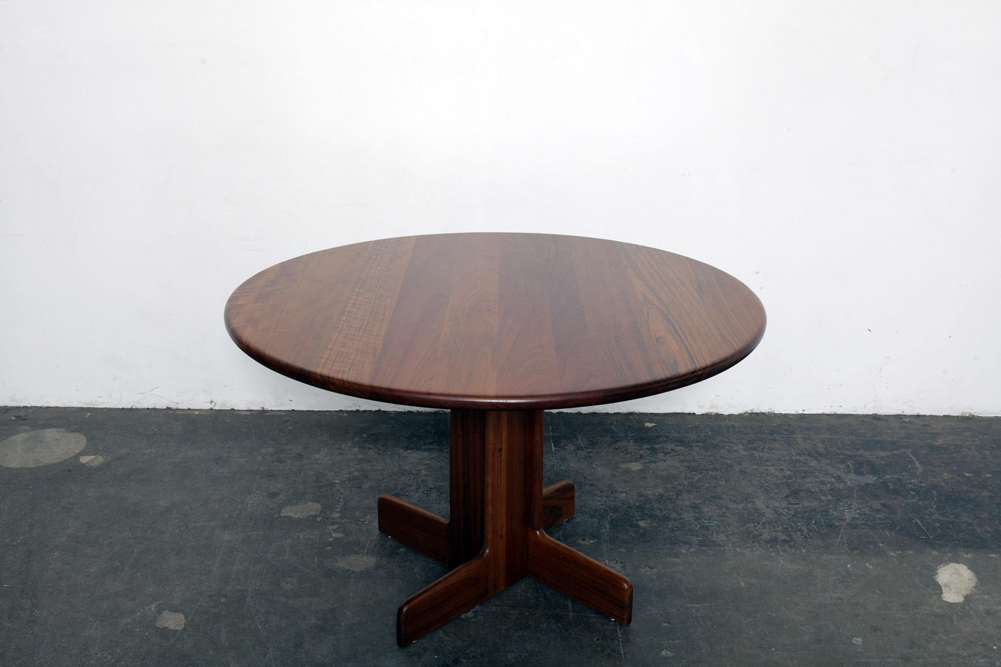 Solid African sedua wood round dining table with pedestal base, designed by Gerald McCabe, USA, 1970s. Table does not have extensions. Table has been fully refinished with new lacquer. An ideal 4 person table.