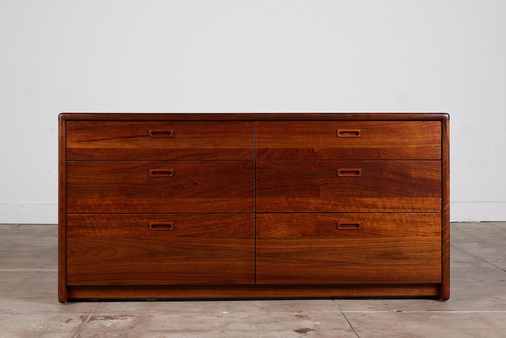 Dresser by Gerald McCabe for Eon Furniture circa 1970s, USA. The Shedua wood dresser, also known as African walnut, features soft rounded edges with six drawers. Each drawer has an inset drawer pull.

Dimensions: 60