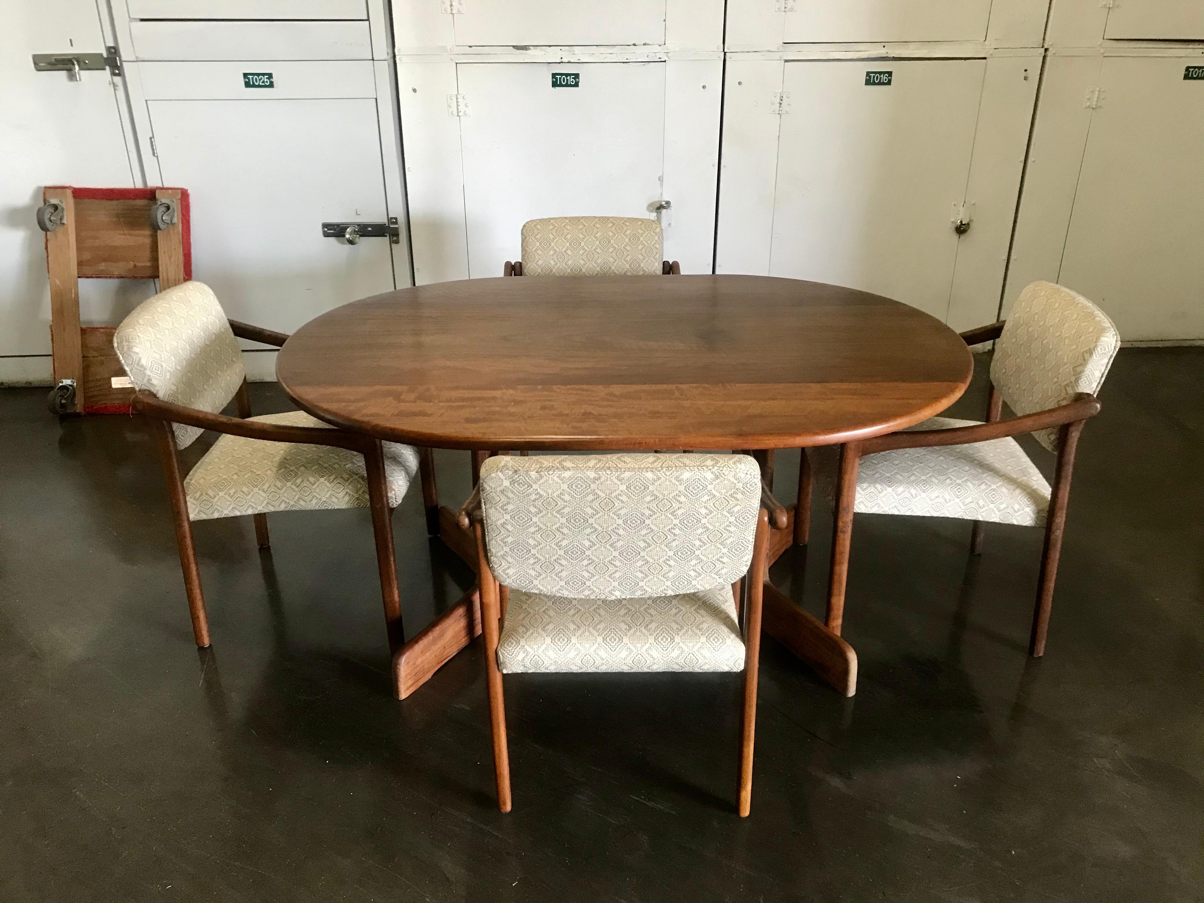 Great California design table and chairs.
Handcrafted solid Shedua wood (African walnut)
Oval top showing the beautiful wood grain in different cuts.
It also has a nice scale, not too big and not too small, with a sturdy footed base 29