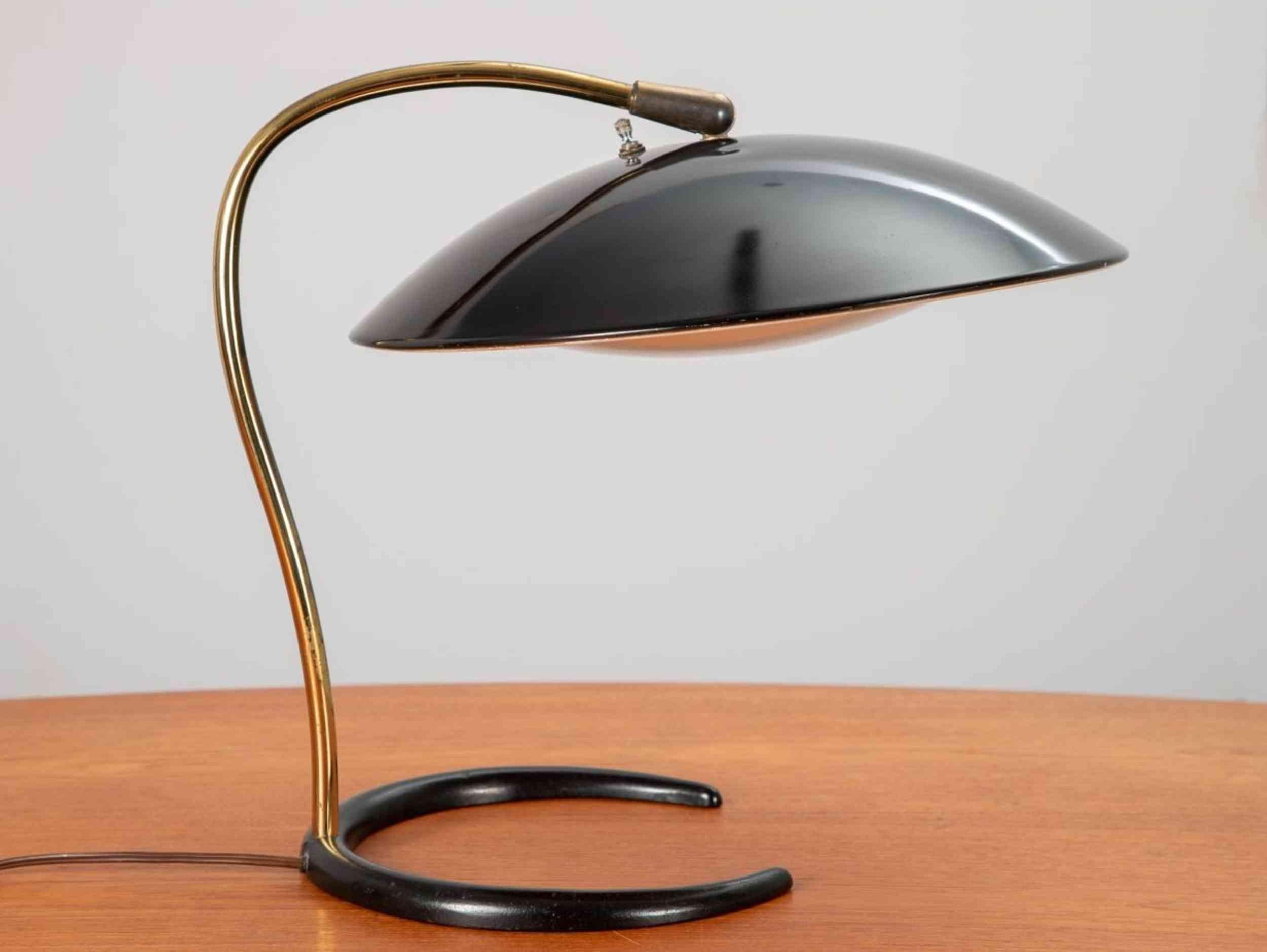 Fantastic table or desk lamp, designed by Gerald Thurston for Lightolier. Wide enameled black shade, articulates from the curved brass base. In wonderful condition overall, original finish intact. Includes the often missing diffuser. 1950s.