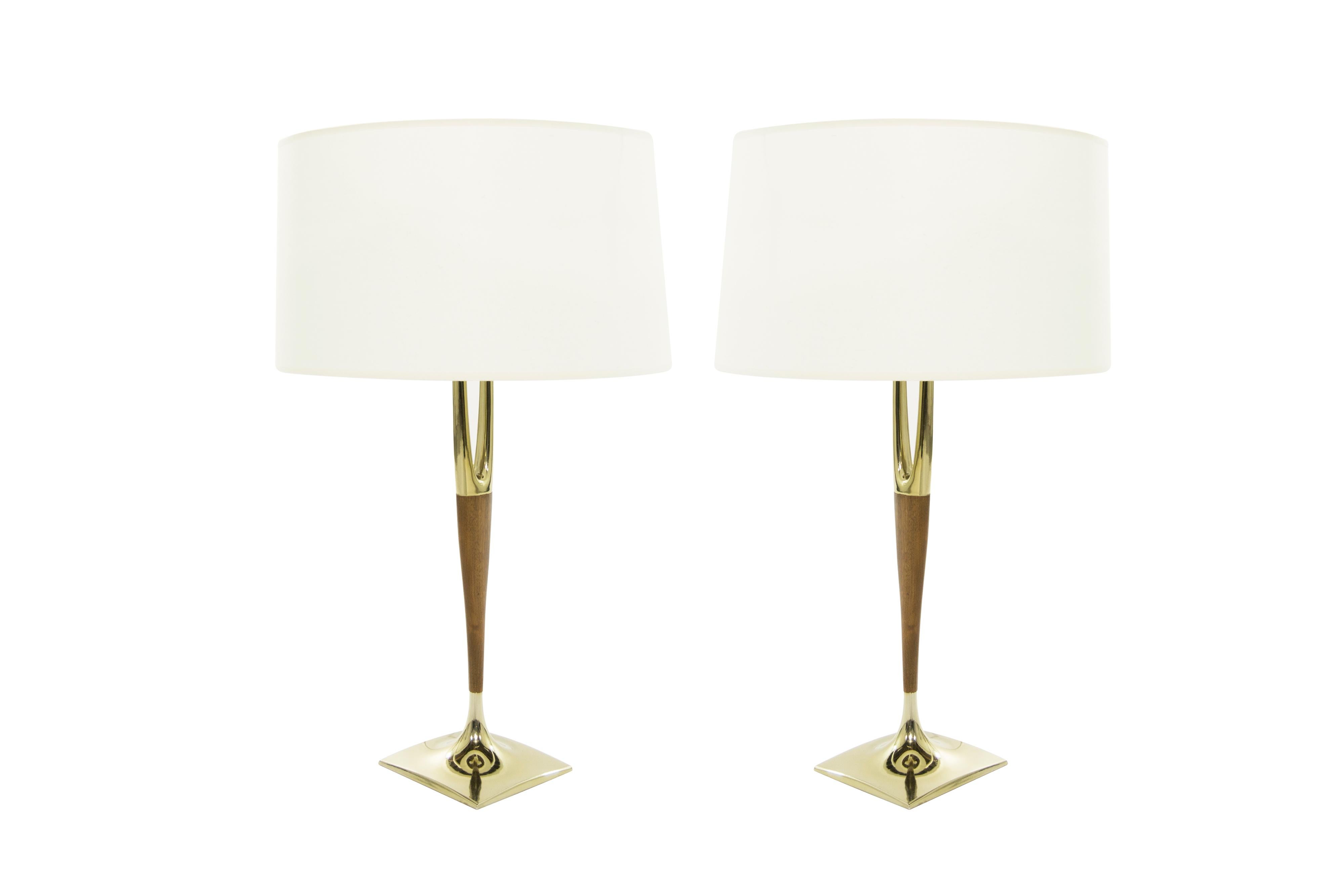 Fully restored pair of brass and walnut table lamps designed by Gerald Thurston for Laurel Lamp Company, circa 1950s.

Brass and walnut have been fully restored. Newly rewired. New linen shades included.