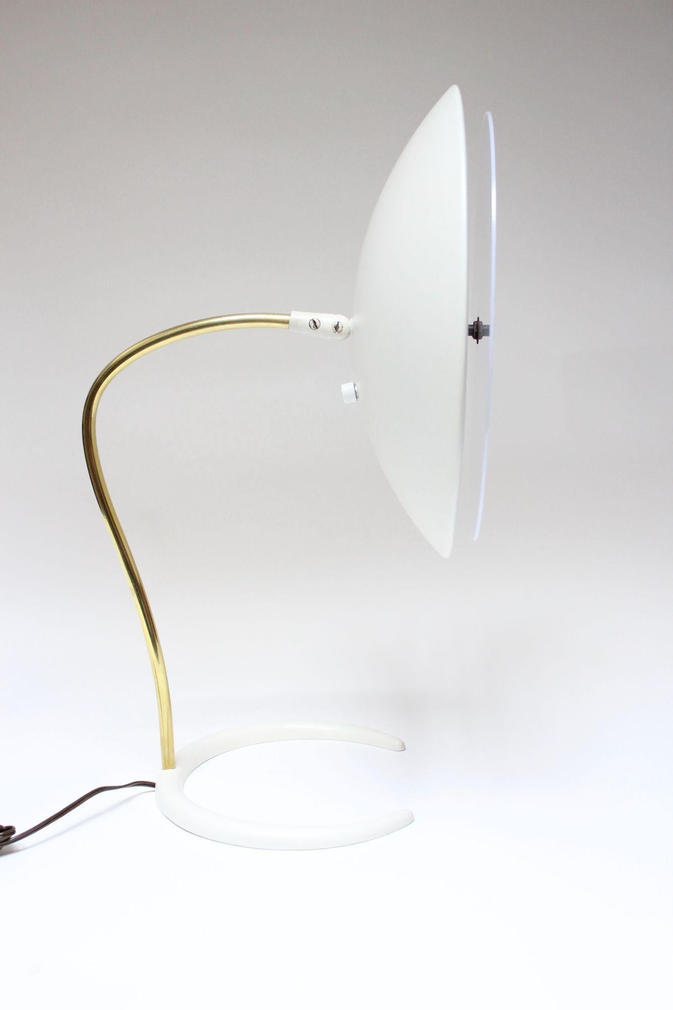 Gerald Thurston for Lightolier table/desk lamp with oversized, fully adjustable/hinged shade, brass stem and crescent base (ca. 1950s, USA). A plexi diffuser has been added (not original to the piece and not required for use). Retains the original