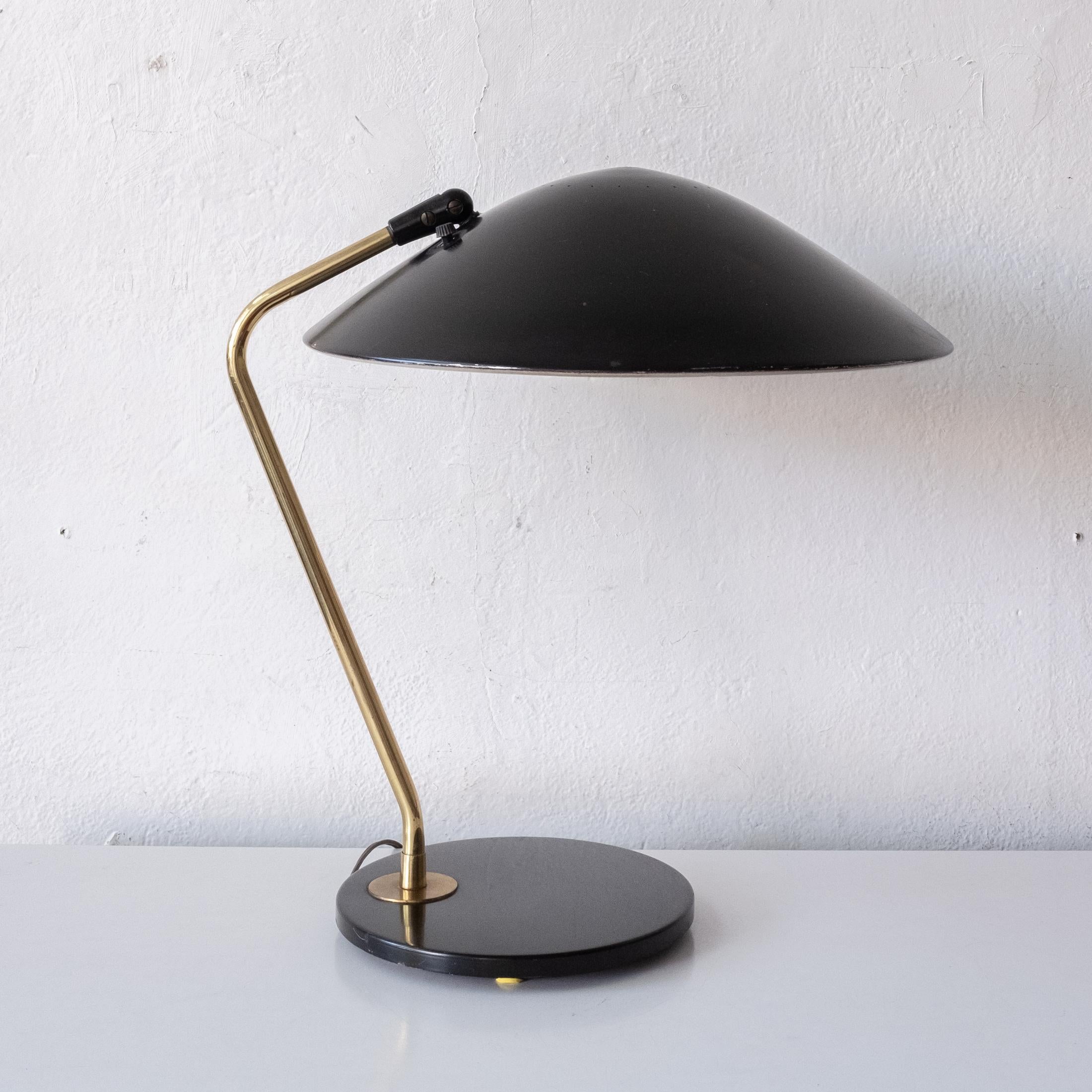 Gerald Thurston for Lightolier desk or table lamp. Black enameled metal with brass. Fully adjustable shade. Great quality. 