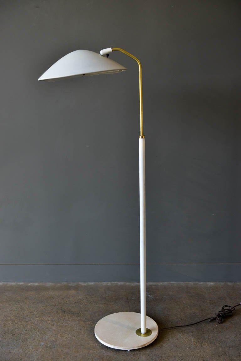 Gerald Thurston for Lightolier Saucer floor lamp, circa 1965. Original wiring and diffuser (most are broken and missing). Beautiful white/off white enamel with brass detailing. Some patina to the base, as shown and some wear to shade. Power switch