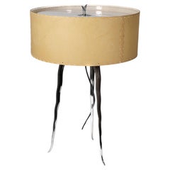 Gerald Thurston in the style of. A Mid-Century tripod polished steel table lamp