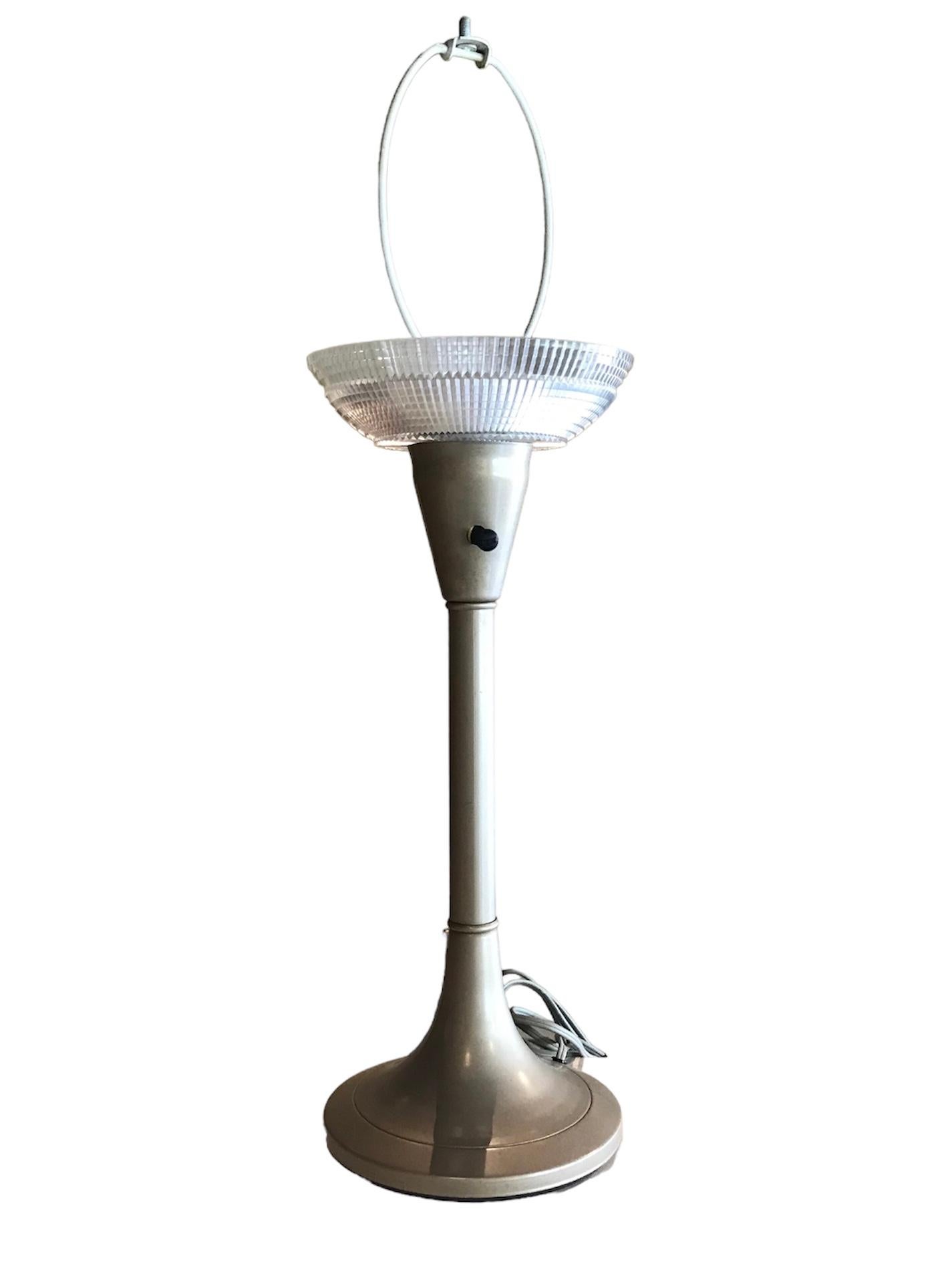 A Mid Century Modern Gerald Thurston classic design style for Lightolier Desk Lamp.  Actually could be used anywhere with it’s streamline metal tulip base body with a built in cut crystal style clear plastic difusser.  Original wiring and socket. 