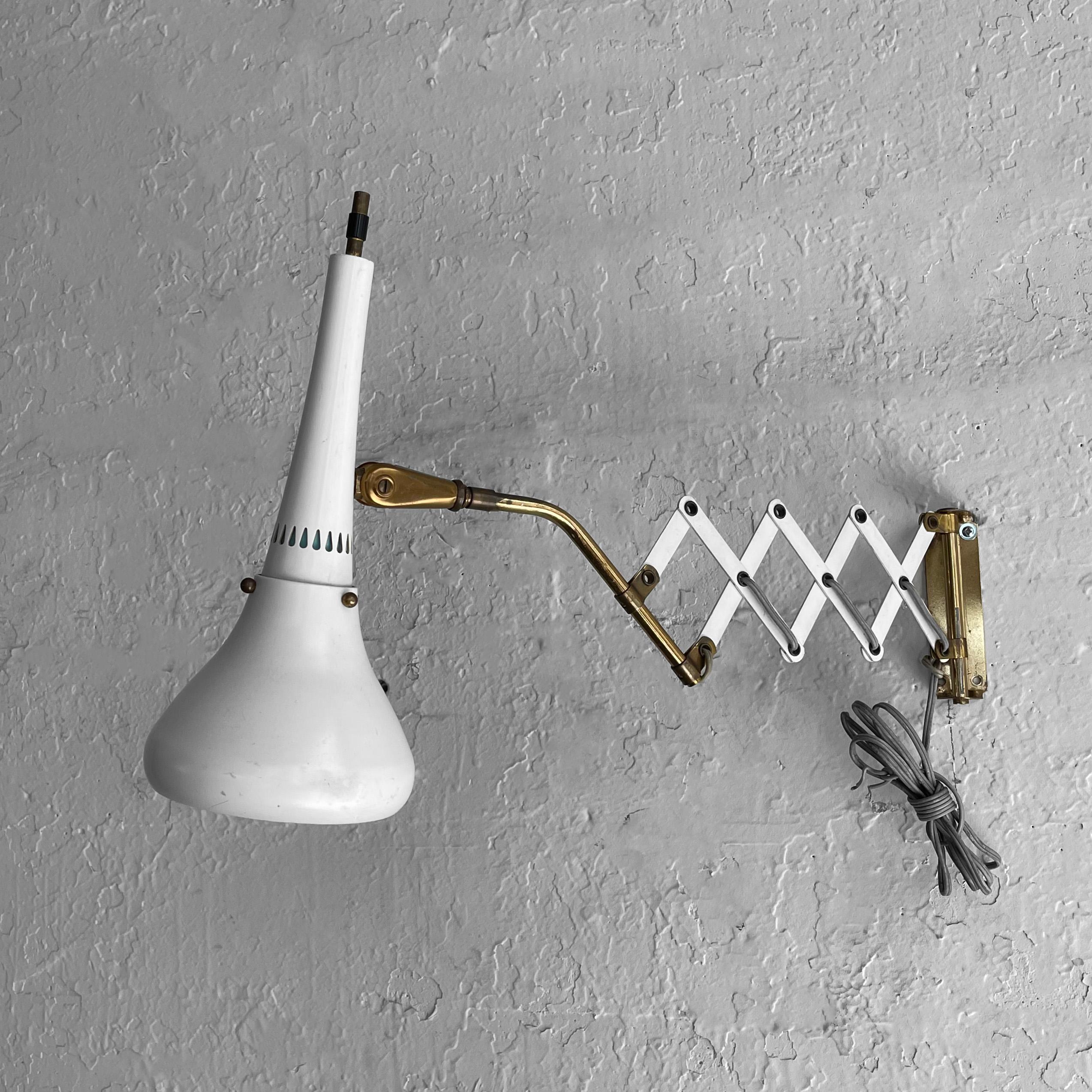 Mid-Century Modern, task lamp, wall sconce by Gerald Thurston for Lightolier features an adjustable, 5.5 inch diameter, painted metal shade on a brass stem and wall plate with an accordian, scissor arm that adjusts from 13 - 24 inches depth