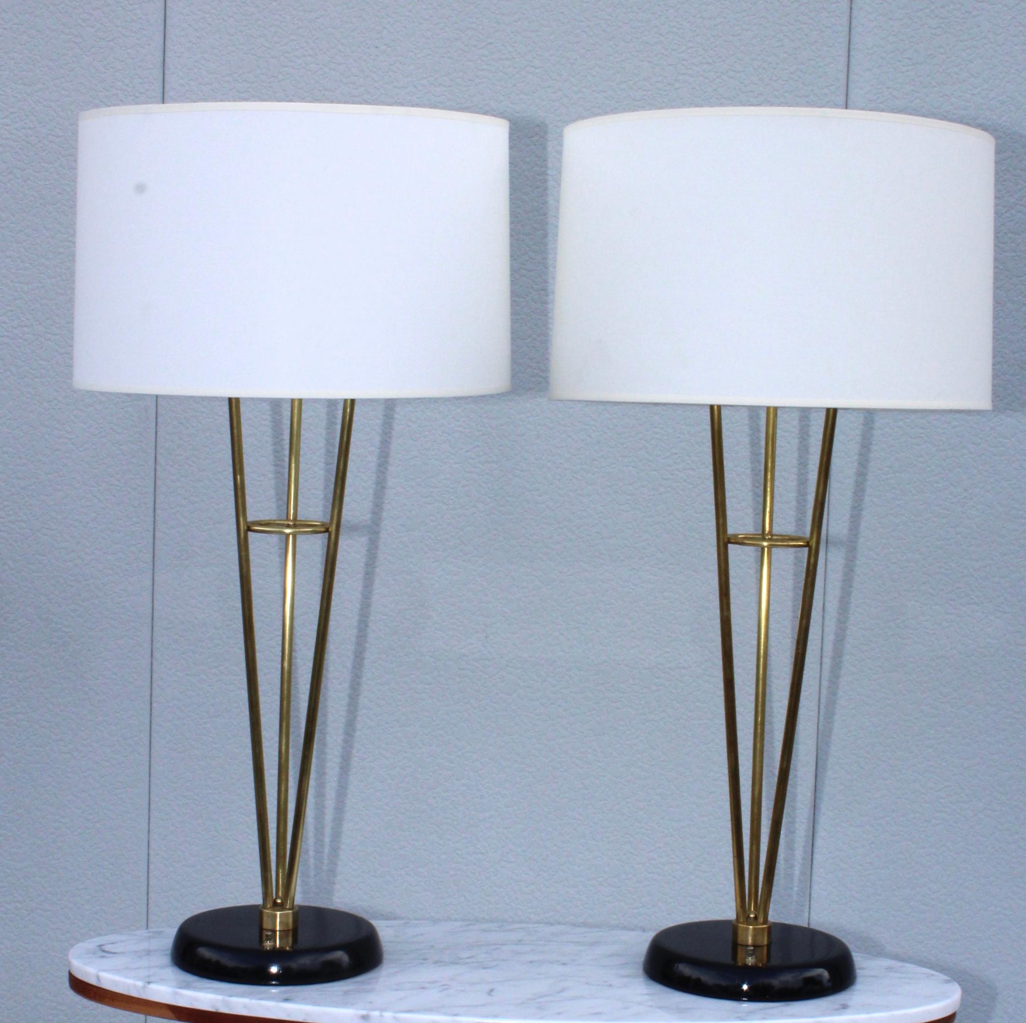 Stunning pair of large 1960s Gerald Thurston style brass table lamps with wood base, newly professionally rewired and ready to use.

Measures: Height to light socket 29.5”

Shades for photography only.