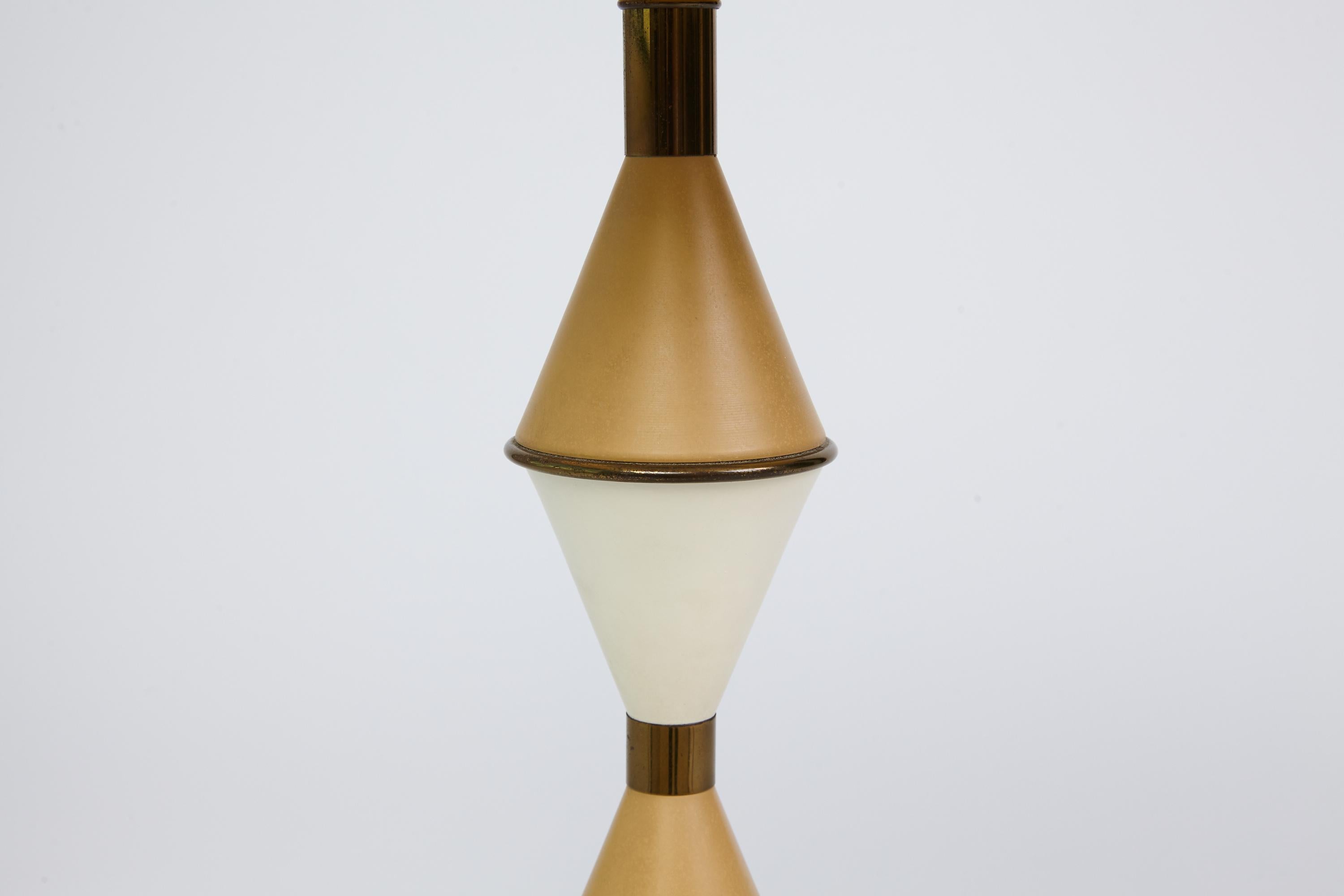 Pair of Mid-Century Modern two-toned enameled stacked cone design lamps in the style of Gerald Thurston for Lightolier. Shades shown just for display and not included.