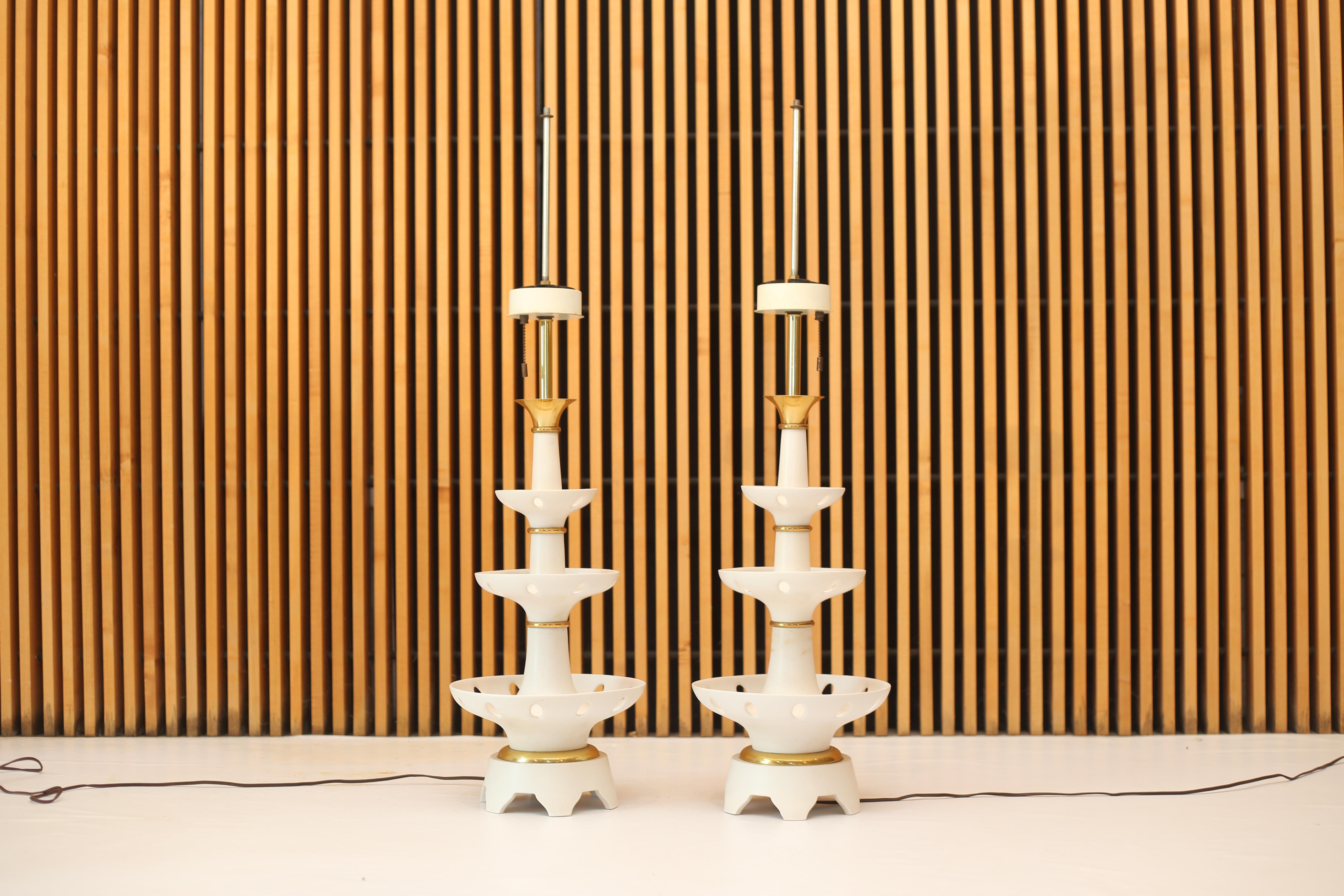 A pair of lamps designed by Gerald Thurston for Lightolier. 

Lamps have original wiring in working order. 
Overall in excellent condition. Sold without lamp shades or finials. 

Dimensions:
39.5