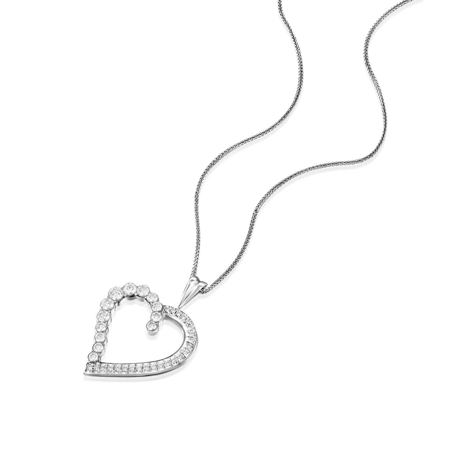 Fall in love with the exquisite Geraldo 1.34 Carat Diamond White Gold Heart Pendant, a true masterpiece of jewelry design. This pendant features a seamless, heart-shaped design, expertly crafted with half of the pendant invisibly set to create a