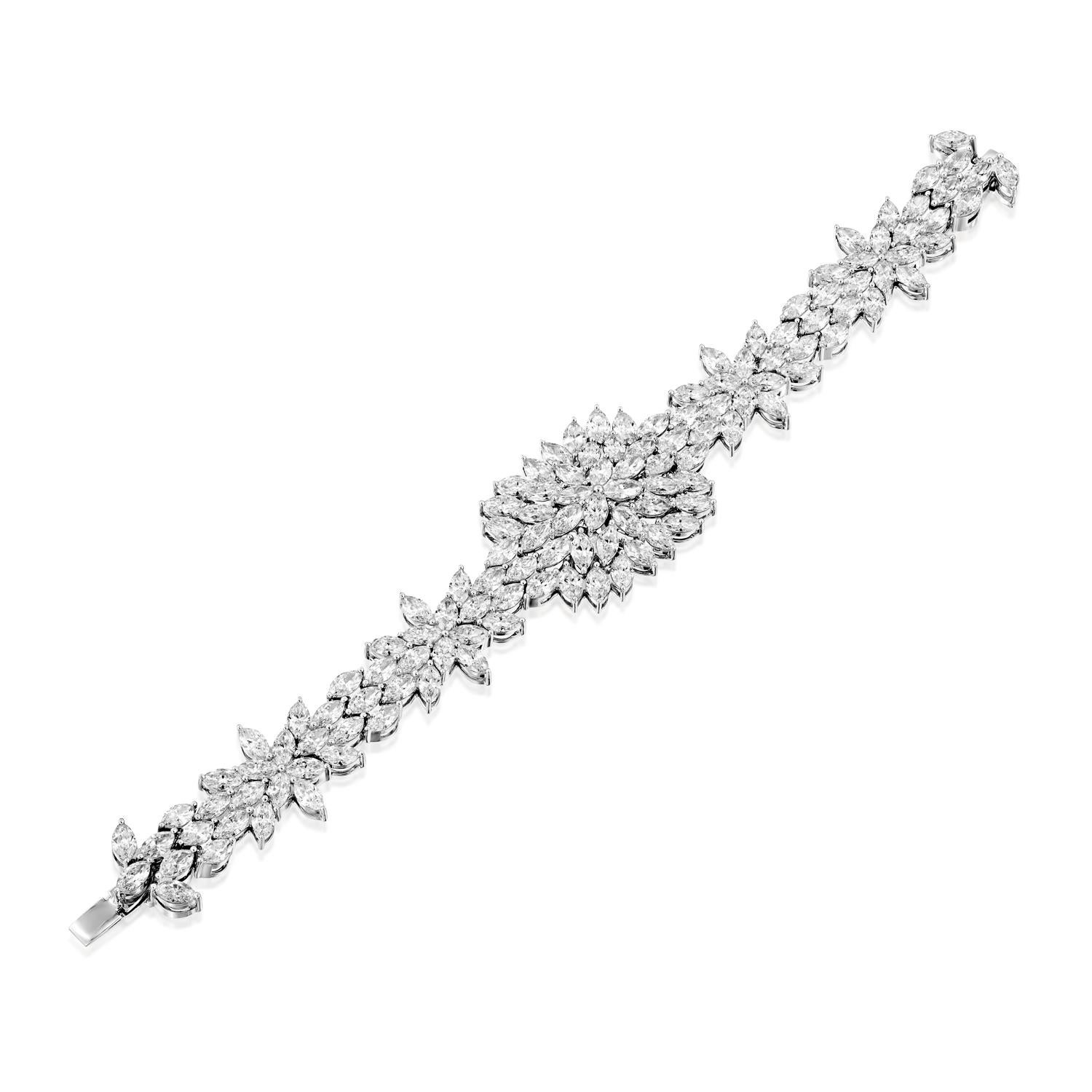 Add a touch of sophistication and glamour to your jewelry collection with the Geraldo 28.64 Carat Marquise Diamond White Gold Bracelet. This stunning bracelet features 28.64 carats of marquise diamonds, all of f/vs-vvs quality, and crafted from the