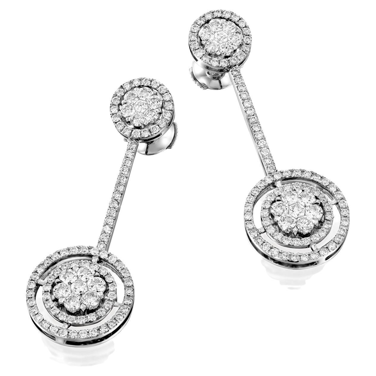 Elevate your style to new heights with the Geraldo 2.95 Carat Diamond White Gold Invisible Setting Earrings, a true masterpiece of jewelry design. These stunning earrings feature 2.95 carats of round diamonds, all set in a combination of invisible