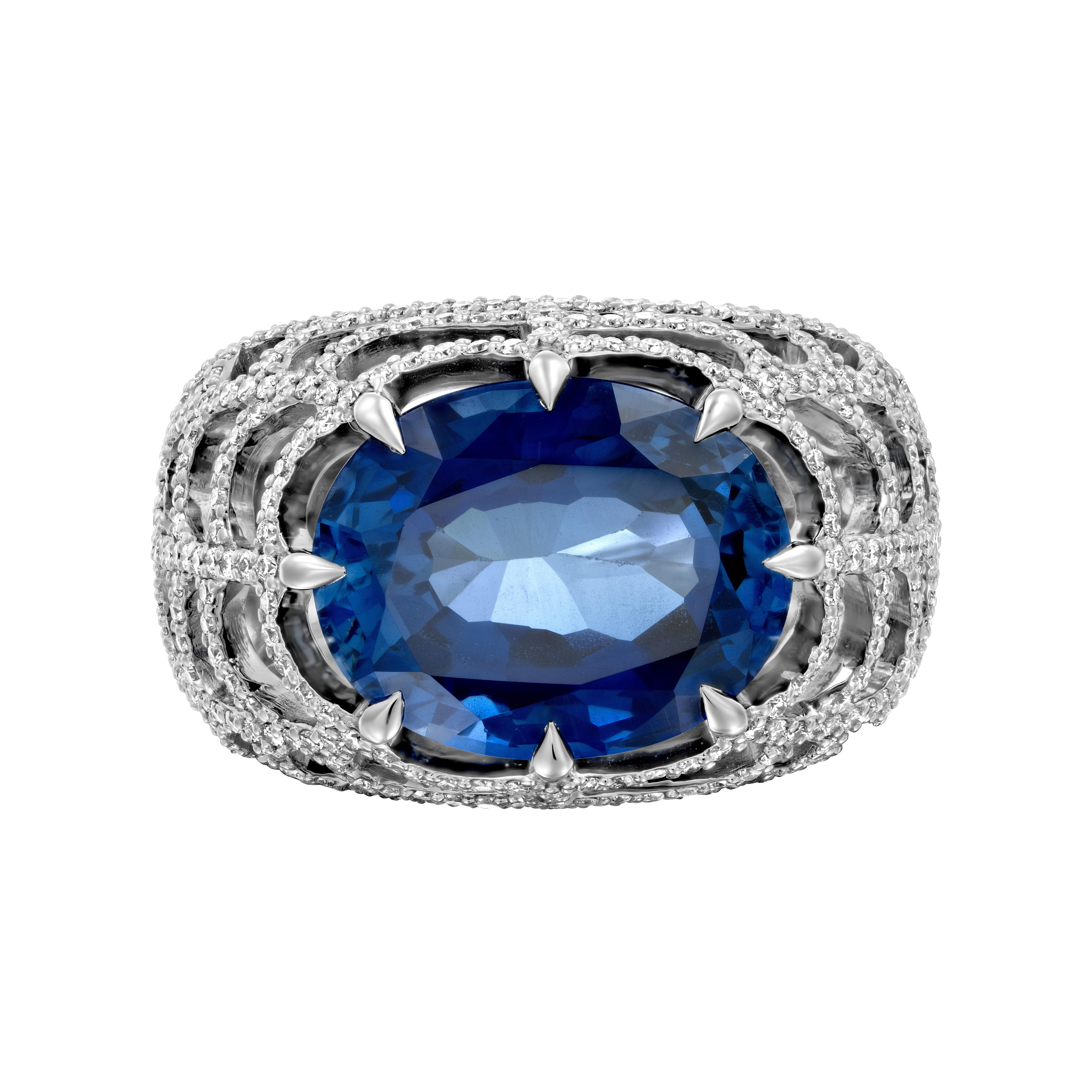 Elevate your style with the breathtaking Geraldo 7-carat Sapphire Diamond Ring, an authentic statement piece that exudes luxury and sophistication. This exceptional ring combines the allure of sparkling round diamonds with the captivating beauty of