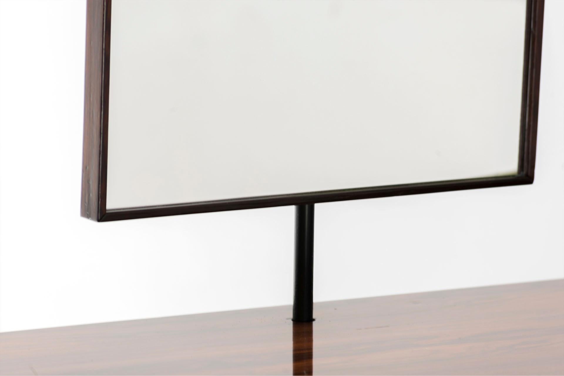 Vanity Desk by Geraldo de Barros
Manufactured by Unilabor Brasil, 1955 Iron, jacaranda, mirror

Measurements
128 cm x 43 cm x 83h cm (149h cm mirror included) 
50,39 in x 16,92 in x 32,67h in (58,66h in mirror included)

Provenance
Private