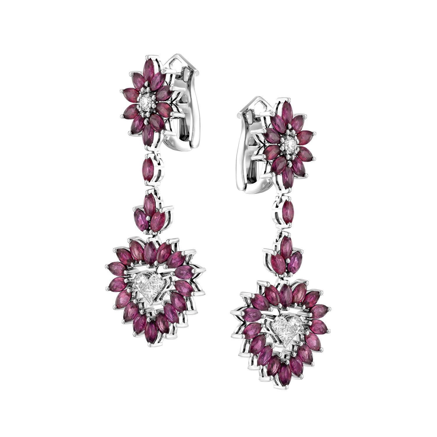 Experience the beauty and joy of life with the Geraldo Ruby Diamond Heart Earrings, a true masterpiece of jewelry design. These stunning earrings feature 7.06 carats of vibrant rubies and 1.85 carats of round diamonds, all set in a combination of
