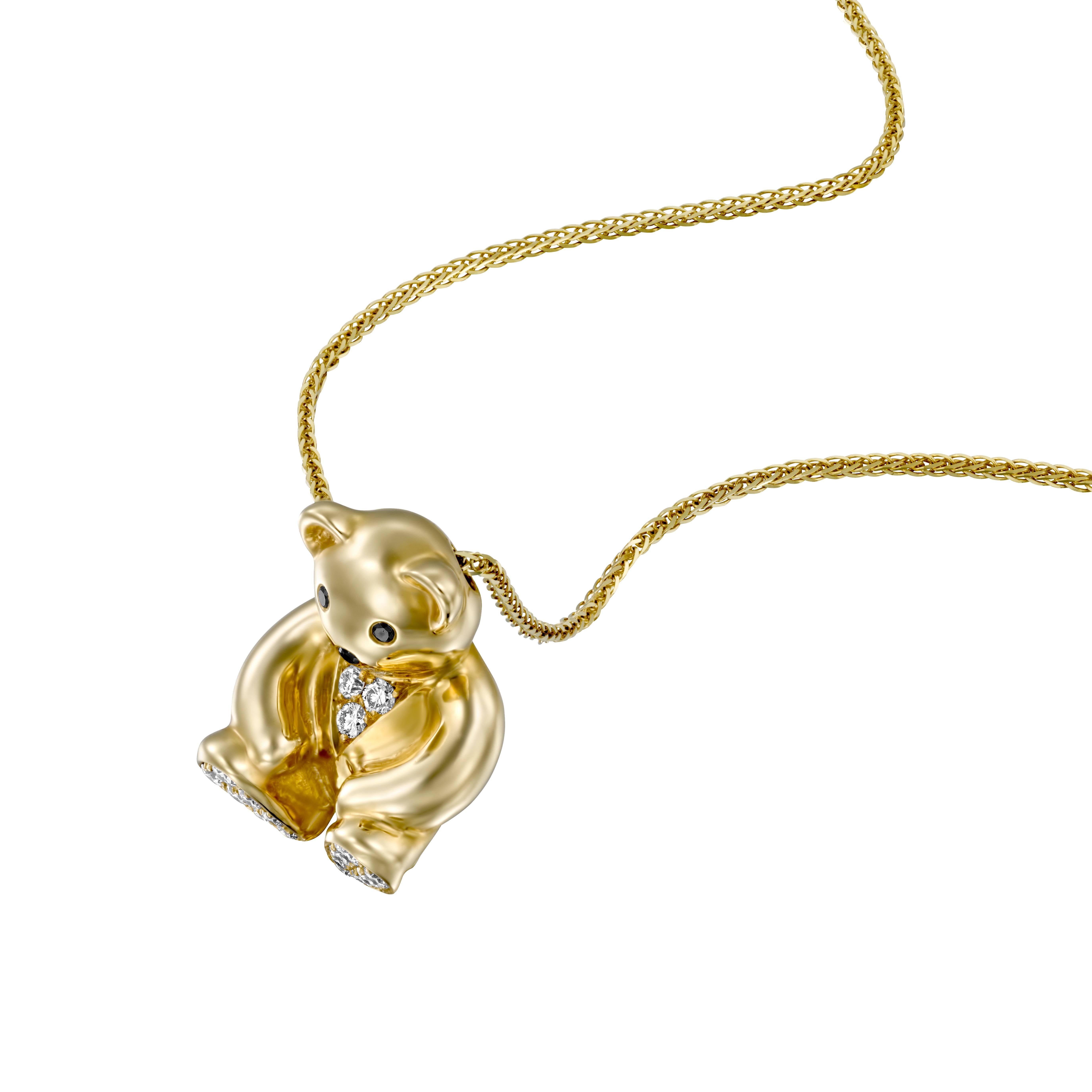 Introducing the adorable Geraldo Yellow Gold Teddy Bear Pendant, a charming piece that captures the essence of joy and playfulness. This delightful pendant is crafted with exceptional artistry, featuring round diamonds and black diamonds set in 14k
